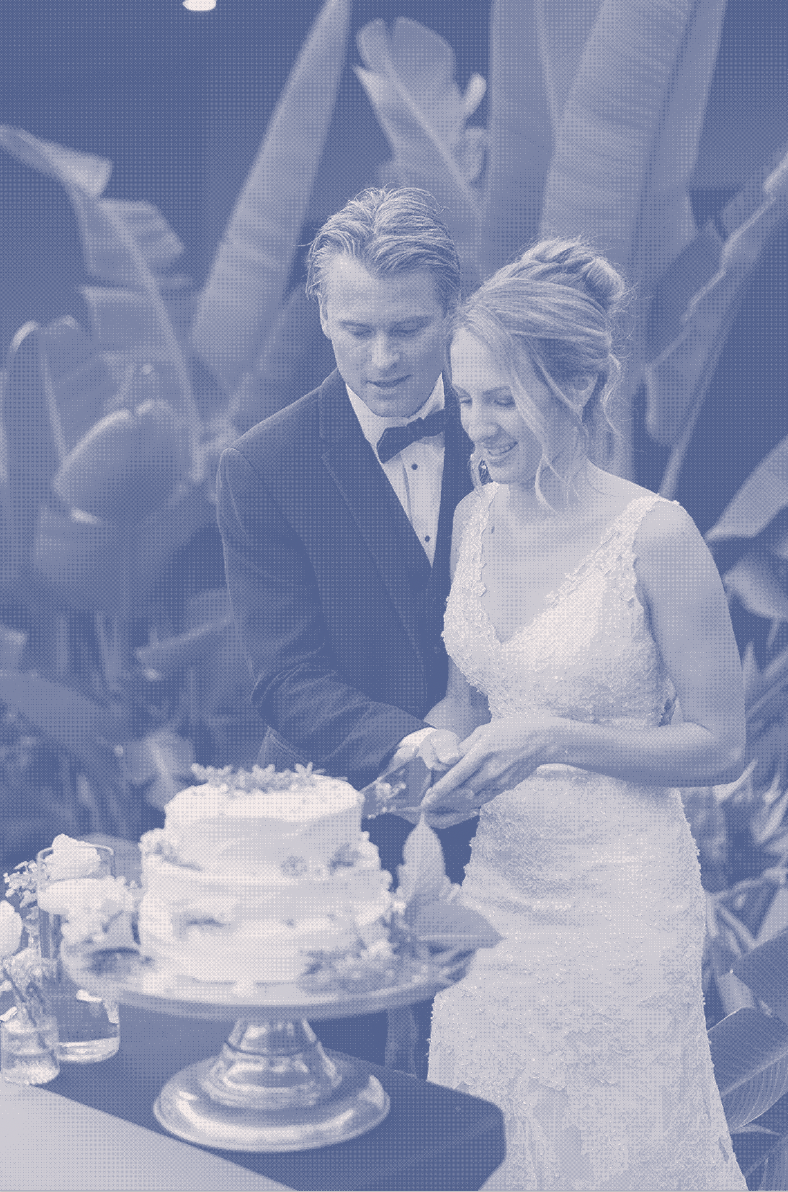 Couple cutting wedding cake