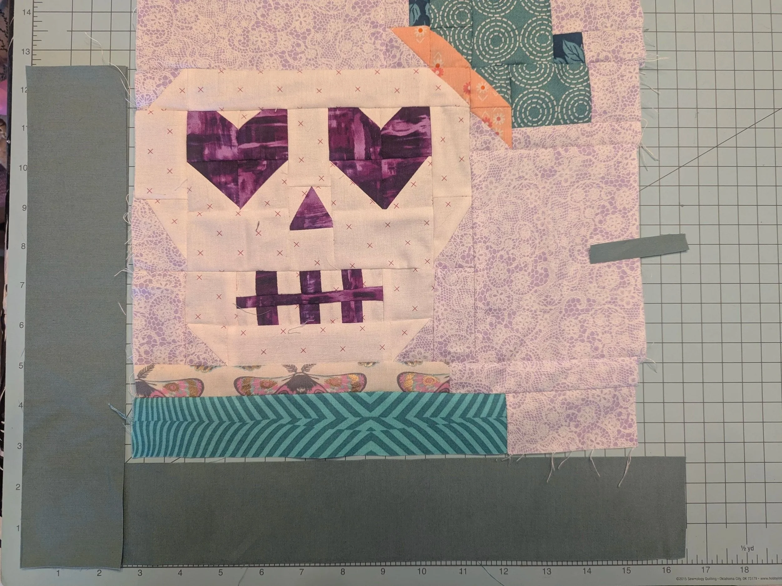quilt block with border strips showing the size to cut as stated in caption