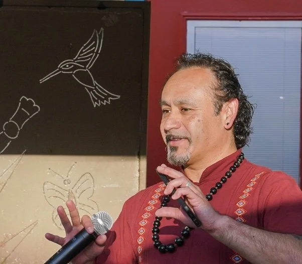 Jesus Solorio speaking at a community event about mental health
