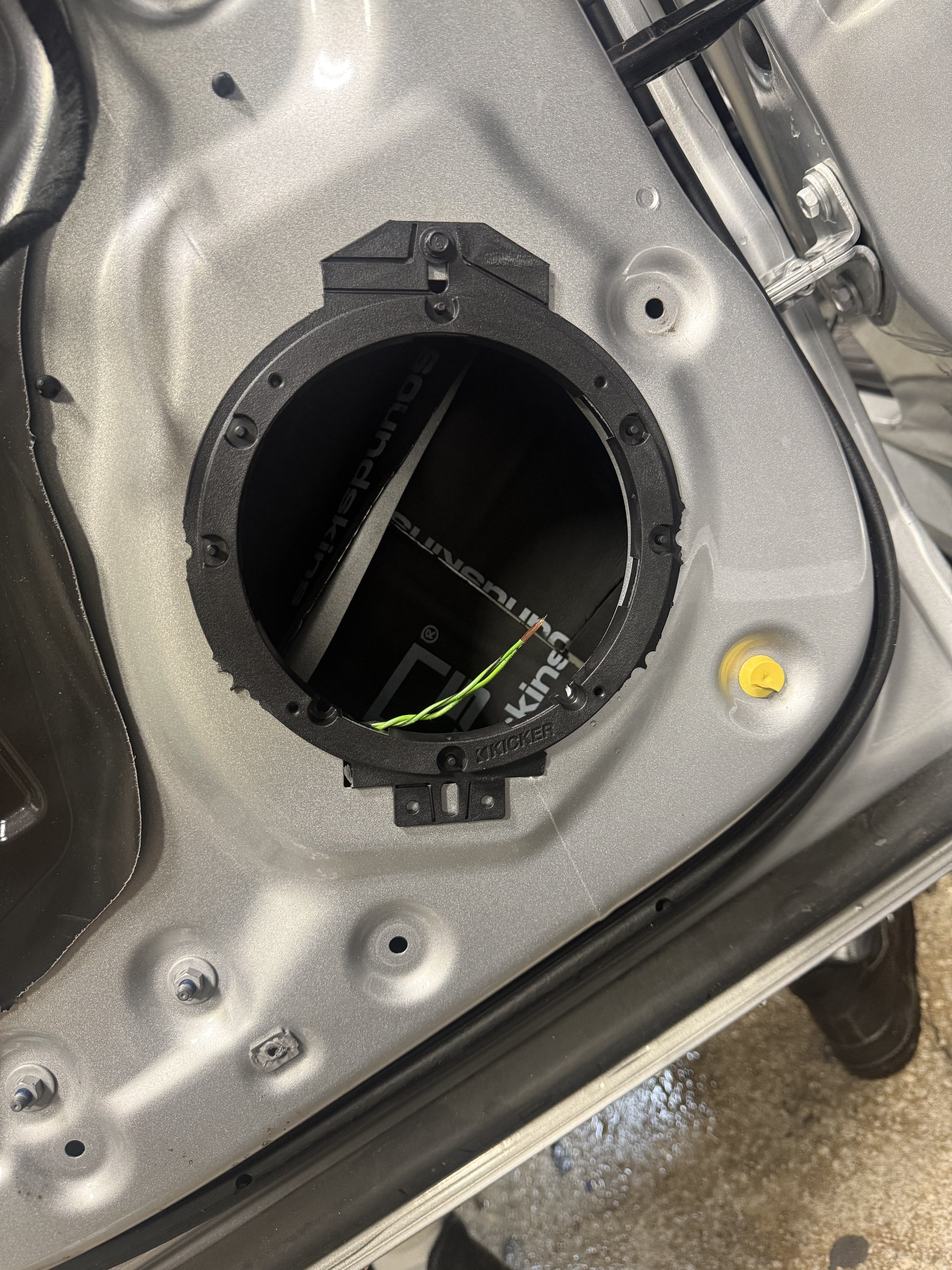 Door speaker opening showing SoundSkins treatment in the RAM 2500 installation
