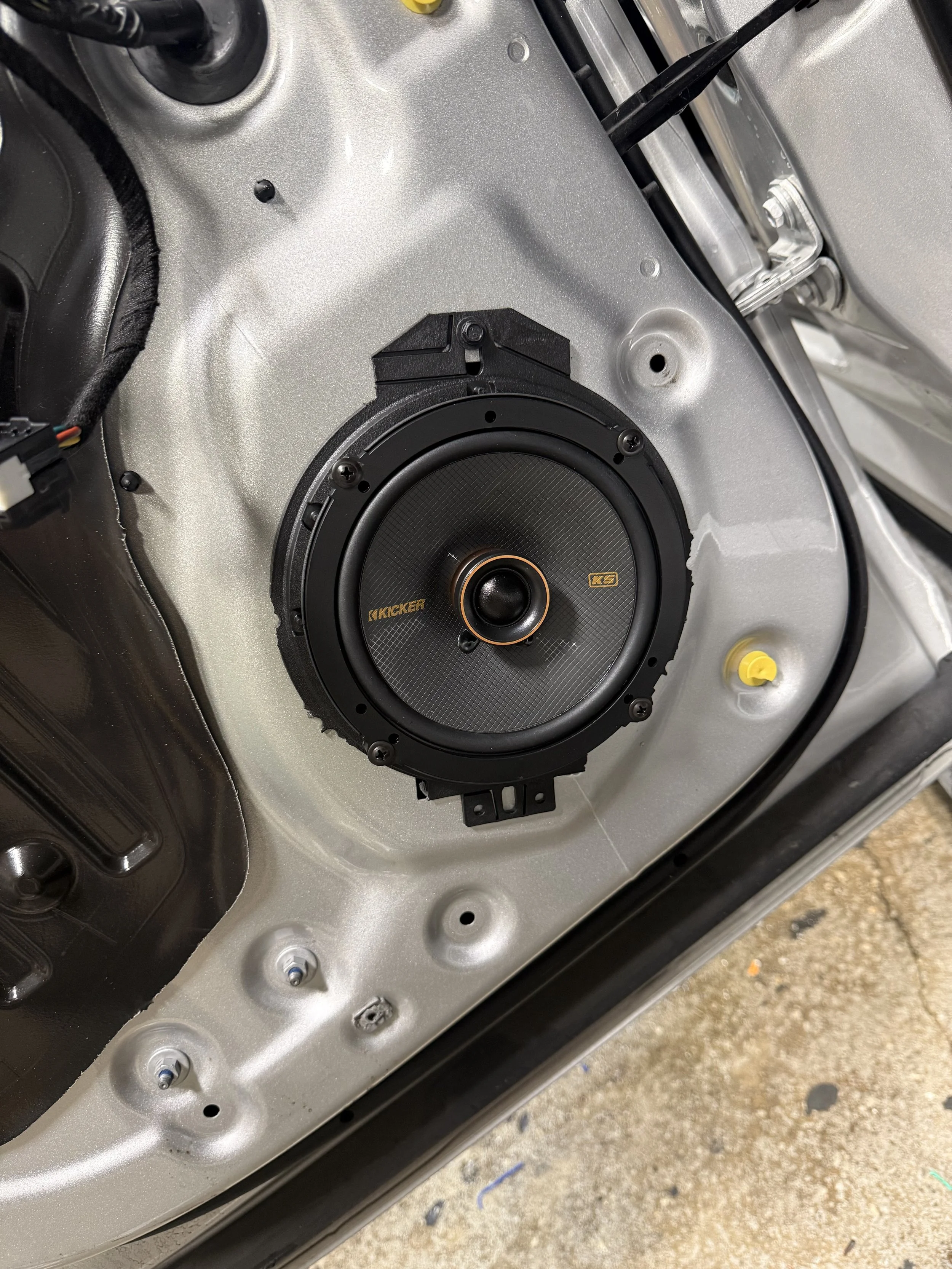 KICKER speaker fitted to the factory door speaker location in a 2025 RAM 2500