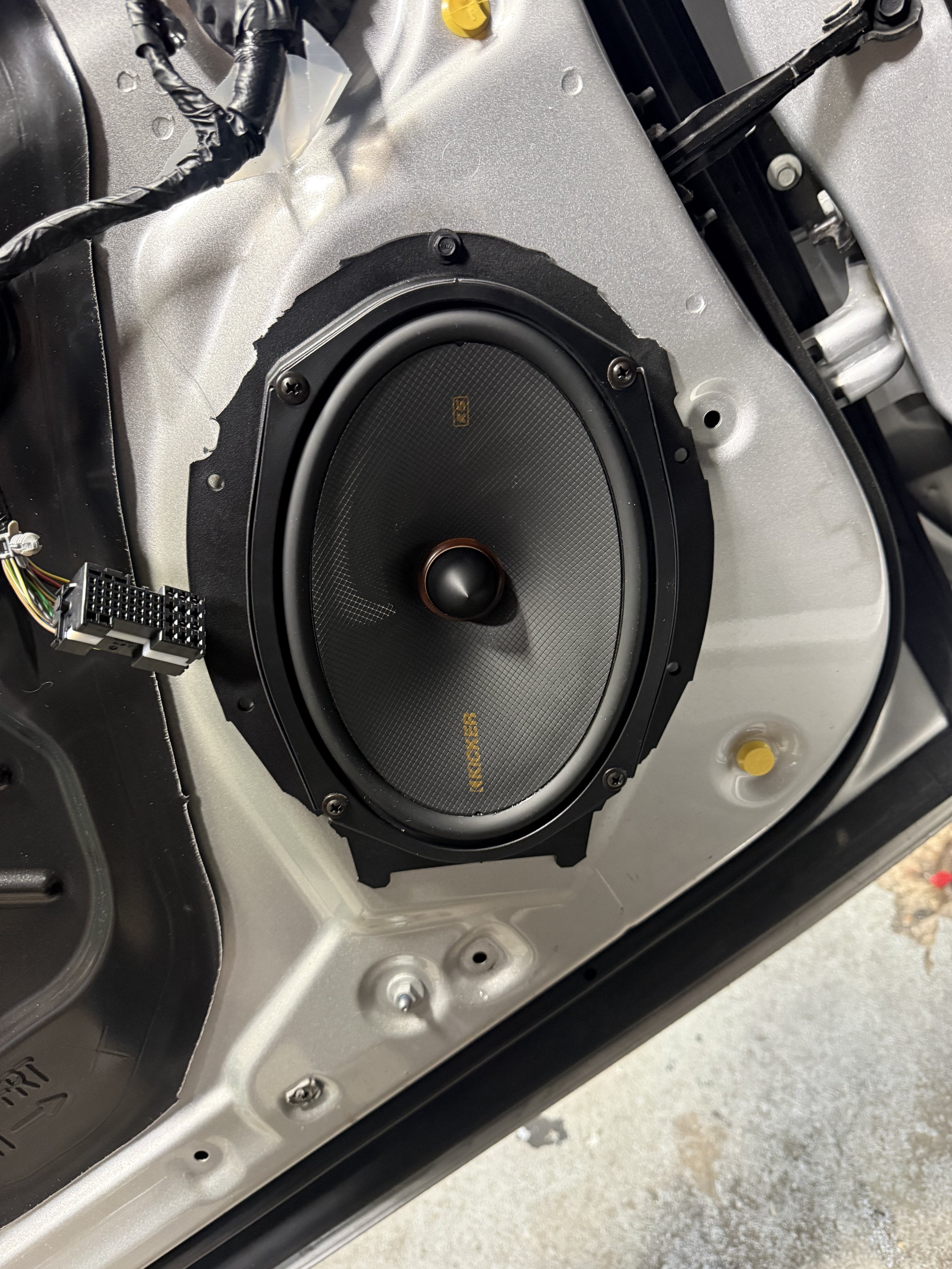 KICKER KS Series 6x9 speaker installed in a 2025 RAM 2500 door