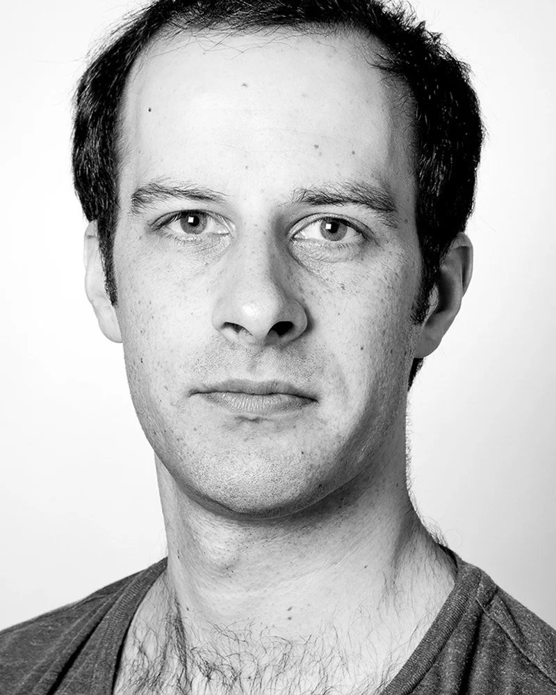 Black and white portrait of a man with short hair