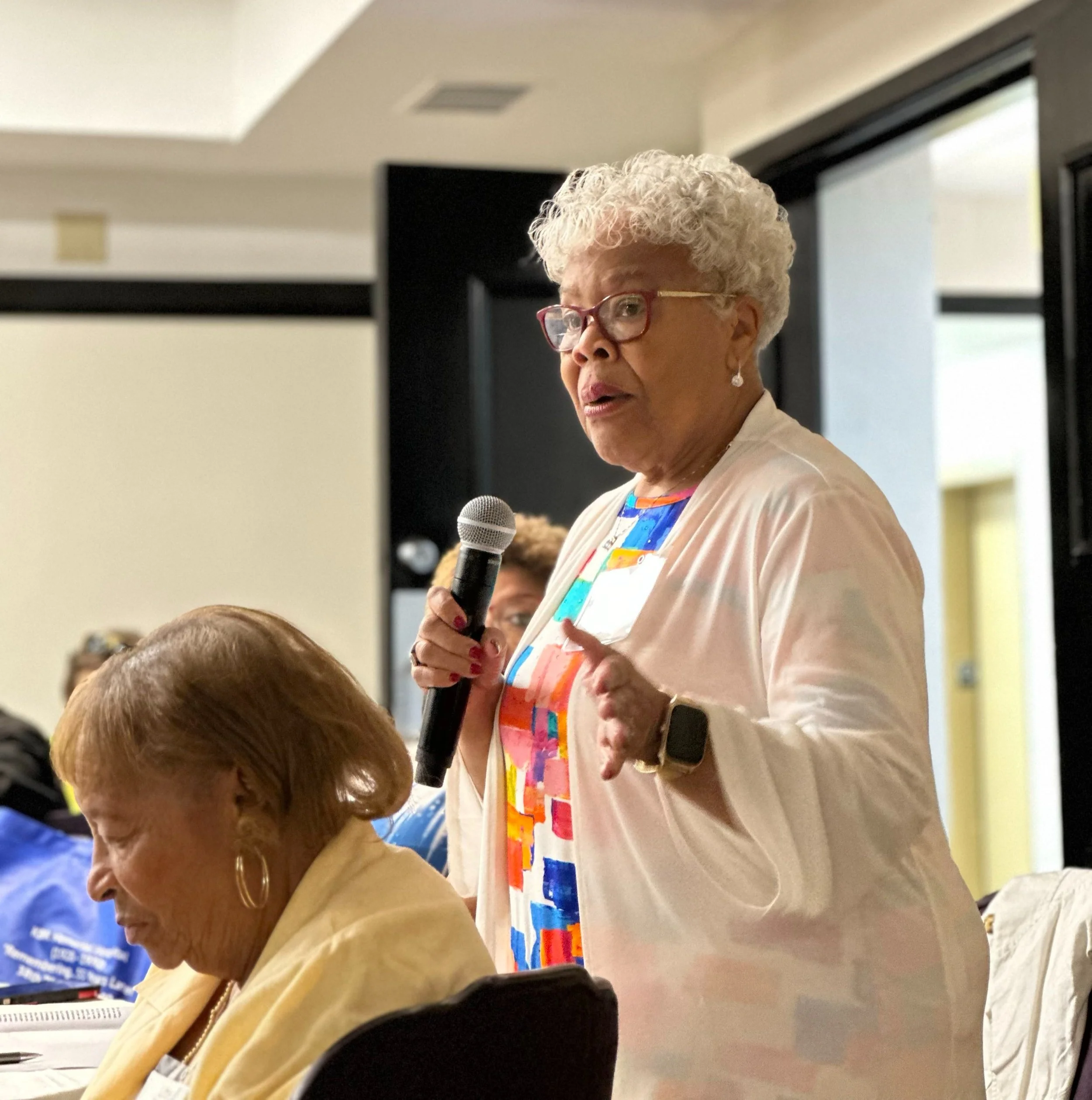 Jeannette C. Glenn, a 1966 graduate, speaks during the 38th reunion in 2025.