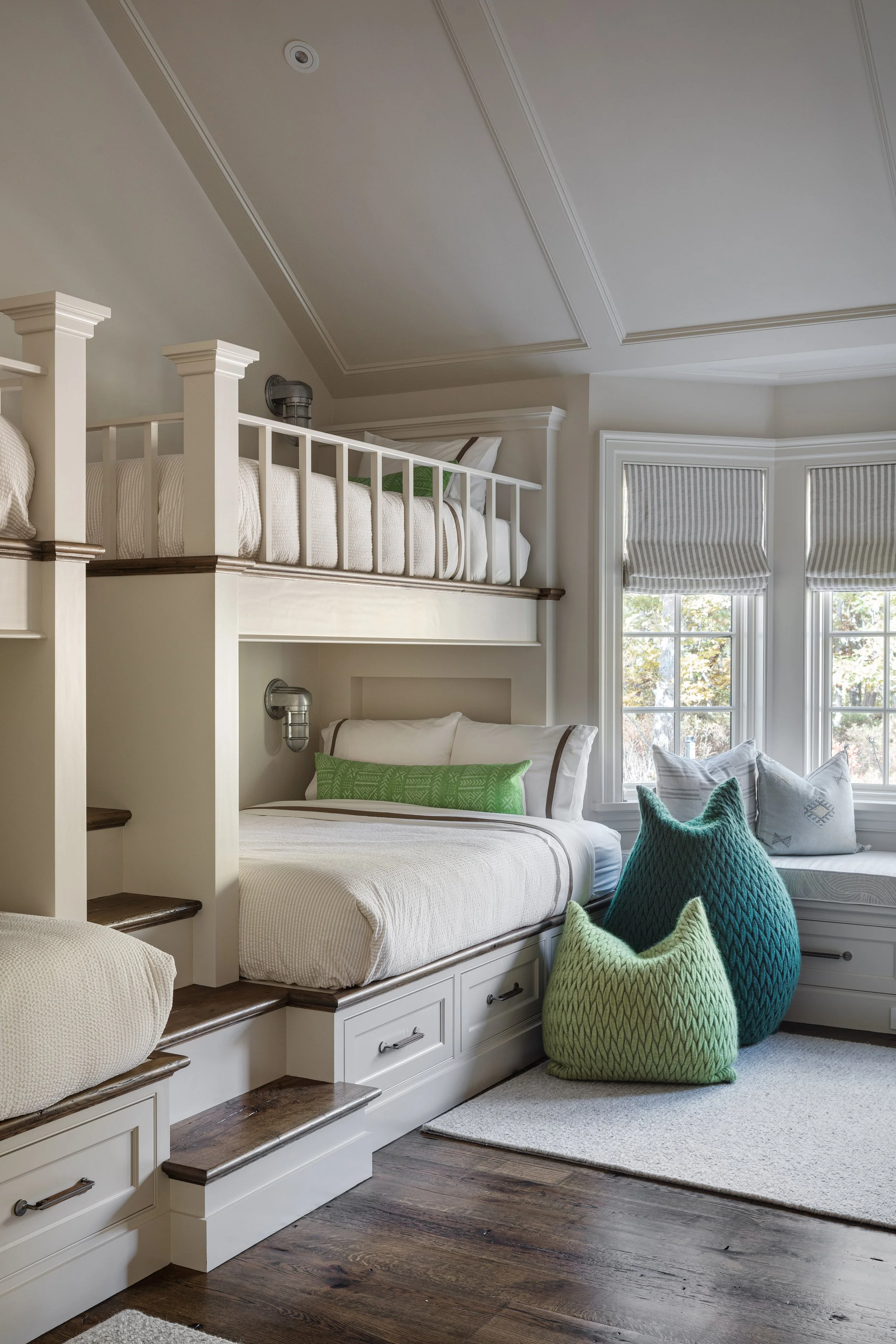 Detail of bunk room by Good Bones Design with soft greens, blues and white