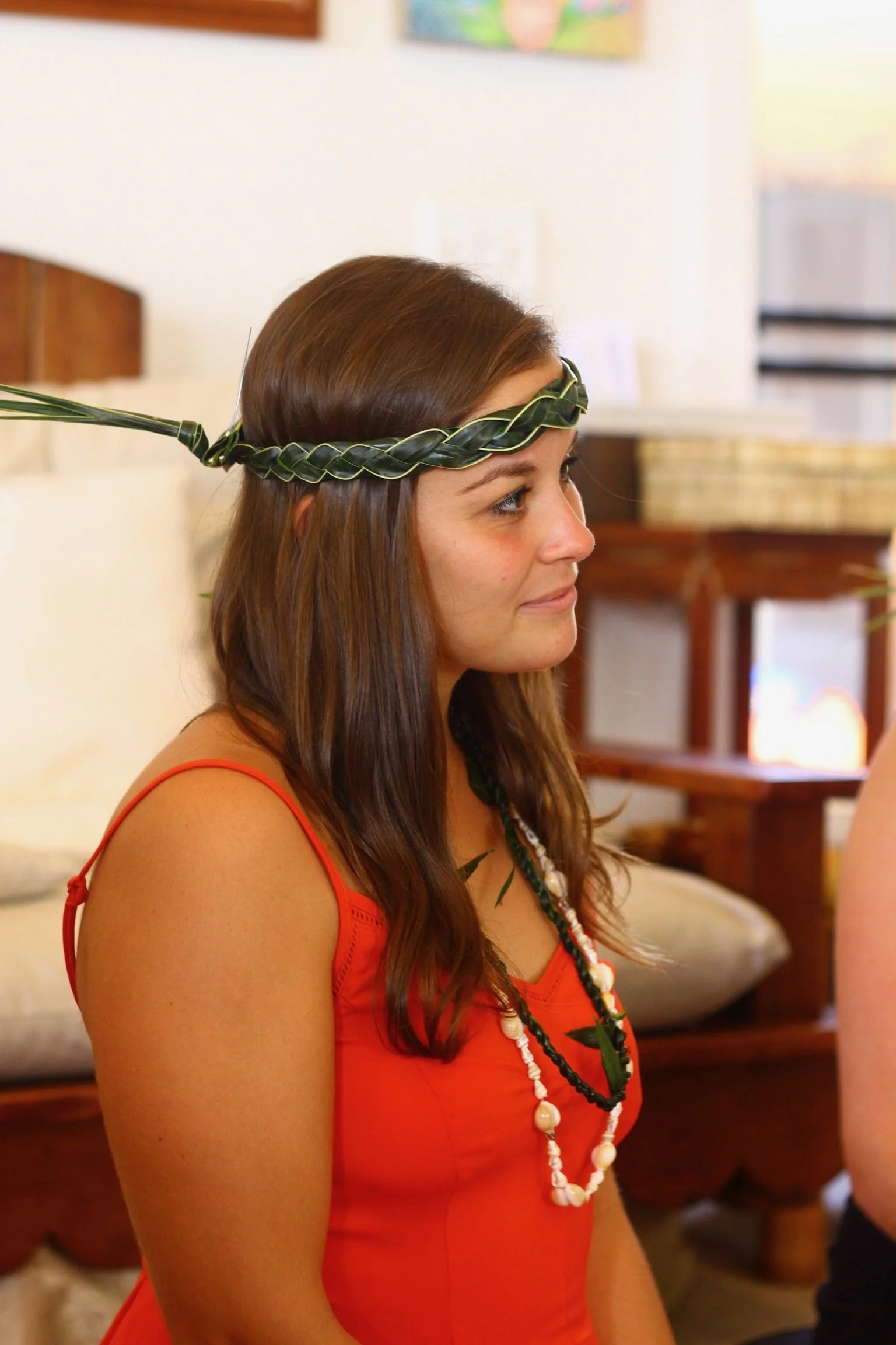 A yoga student wearing a leafy crown and mala beads at Konalani.