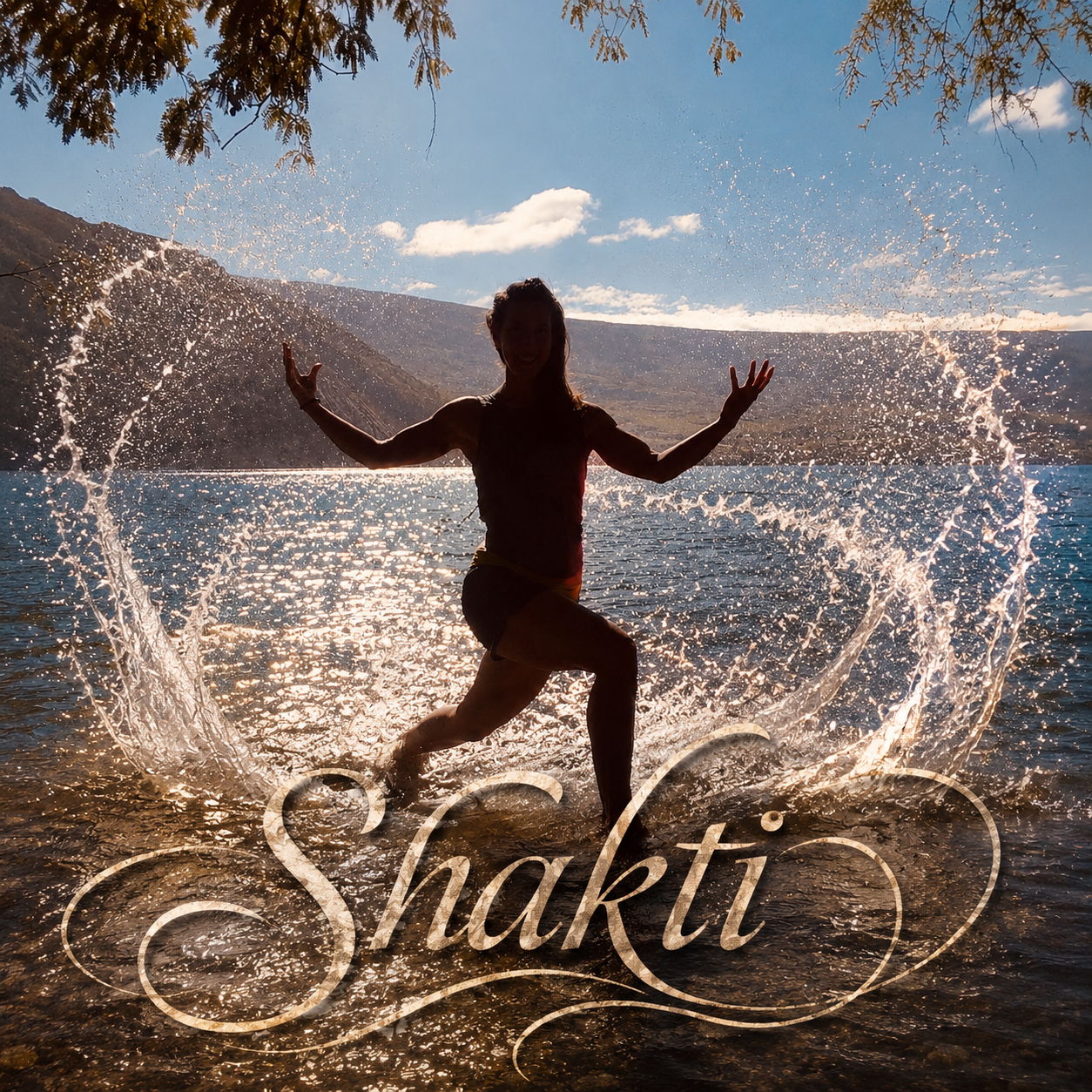 A woman splashing water in a lake with mountains in the background, sunlight reflecting off the water, and the word 'Shakti' overlaid at the bottom.