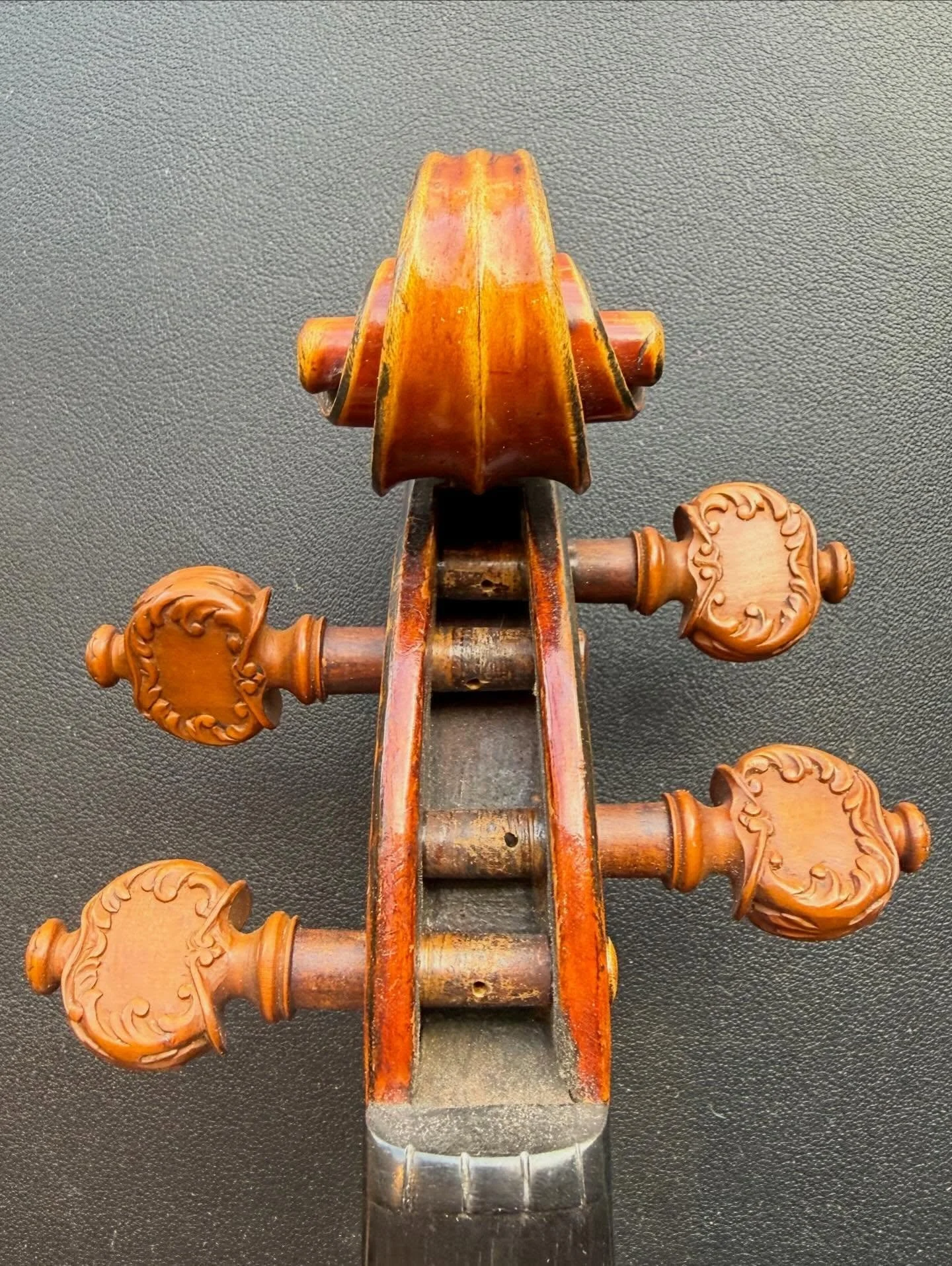 Exceptional little Gand P&eacute;re violin in for a setup overhaul. Scroll does everything it needs to.