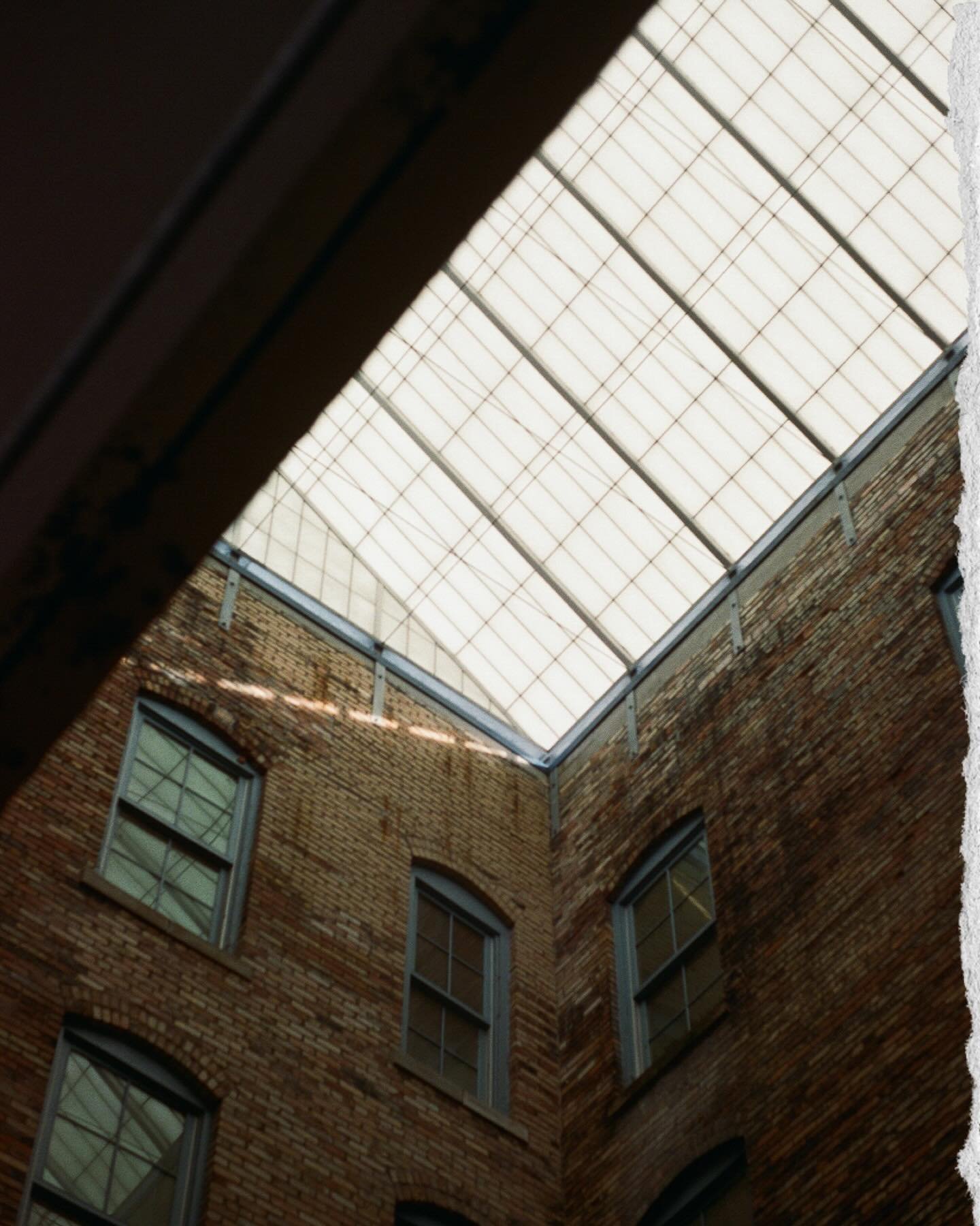 Ryan and Lauren first met 12 years ago riding the same bus to school. They&rsquo;re getting married next fall and we spent their engagement session wandering around the city and found ourselves in the oddest little alcove. A tucked away city-in-a-cit