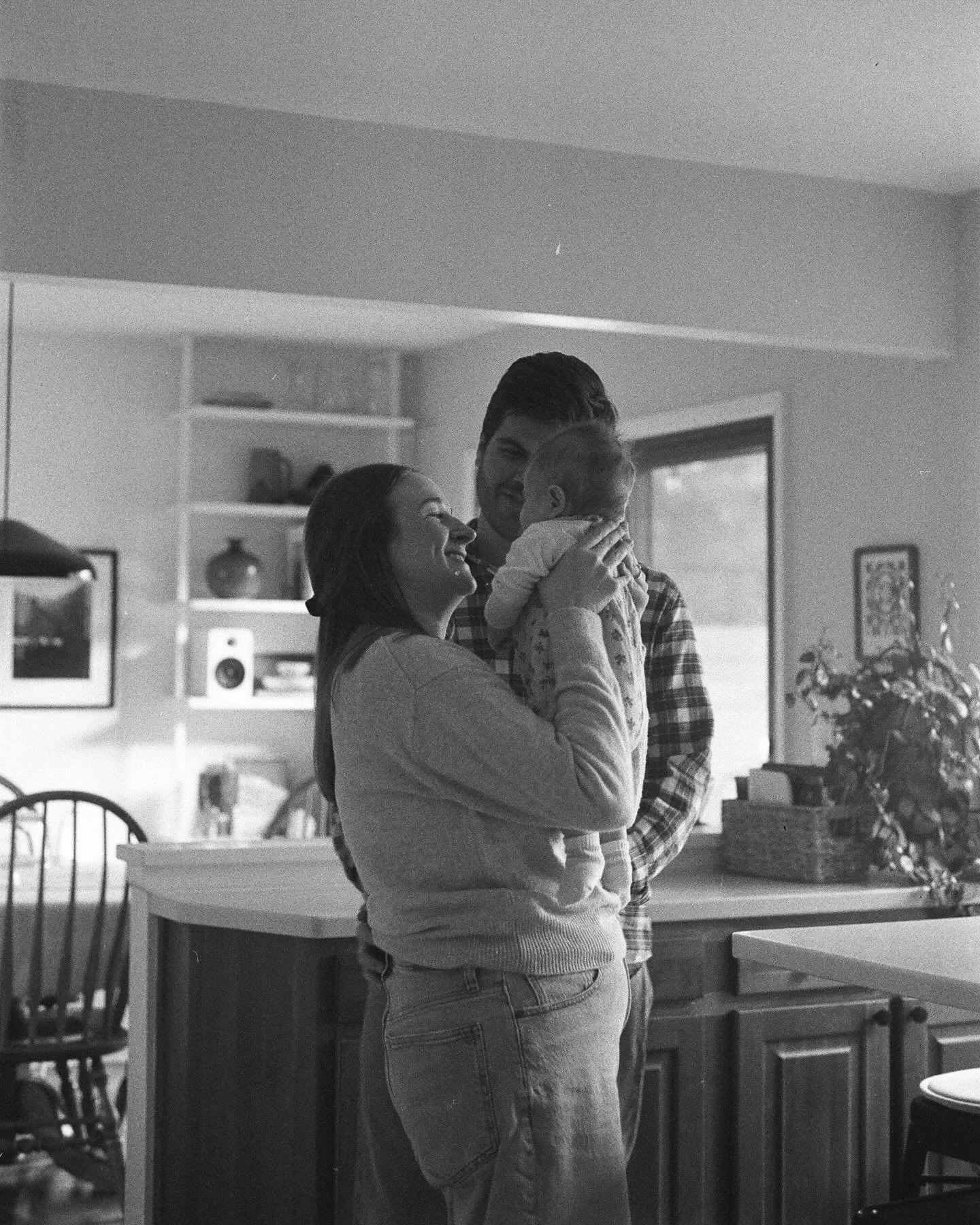 Ryan and Michaella with their daughter, putting socks on in the doorway, playing in the living room, and dancing in the kitchen of their home on IlfordHP5 

Developed and scanned by the best @cameramall 

[Elana KH Photography, Family Photographer in