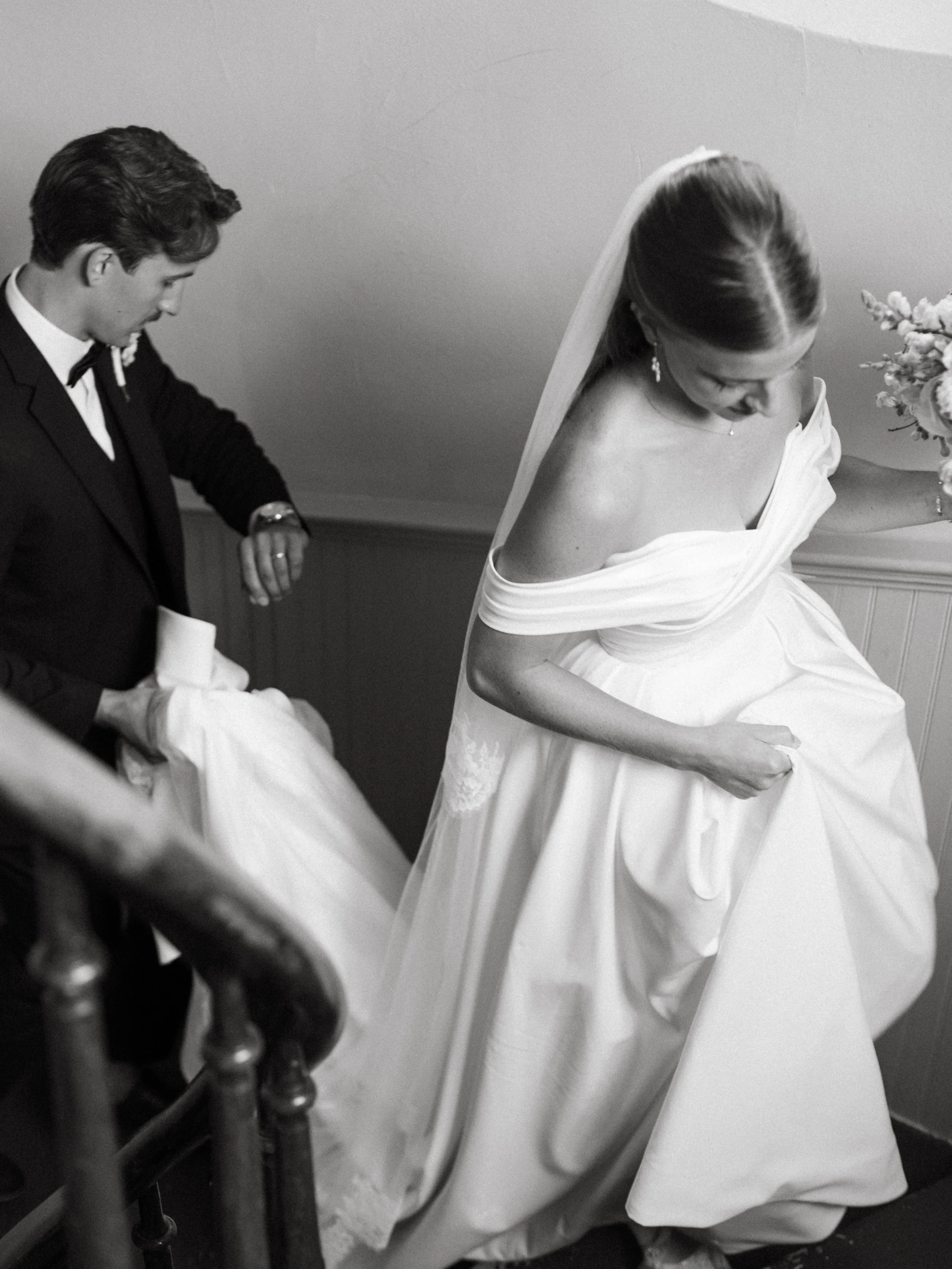 The Schriners, moments after they became husband and wife, running up into the balcony of the church as the rest of their family and friends exited to the reception. My architect brain was screaming because everything about this staircase was magical