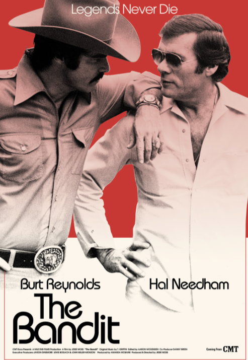 Poster for the movie "The Bandit" featuring Burt Reynolds and Hal Needham, with Burt Reynolds wearing a cowboy hat and Hal Needham wearing sunglasses, against a red background with the text "Legends Never Die" at the top.