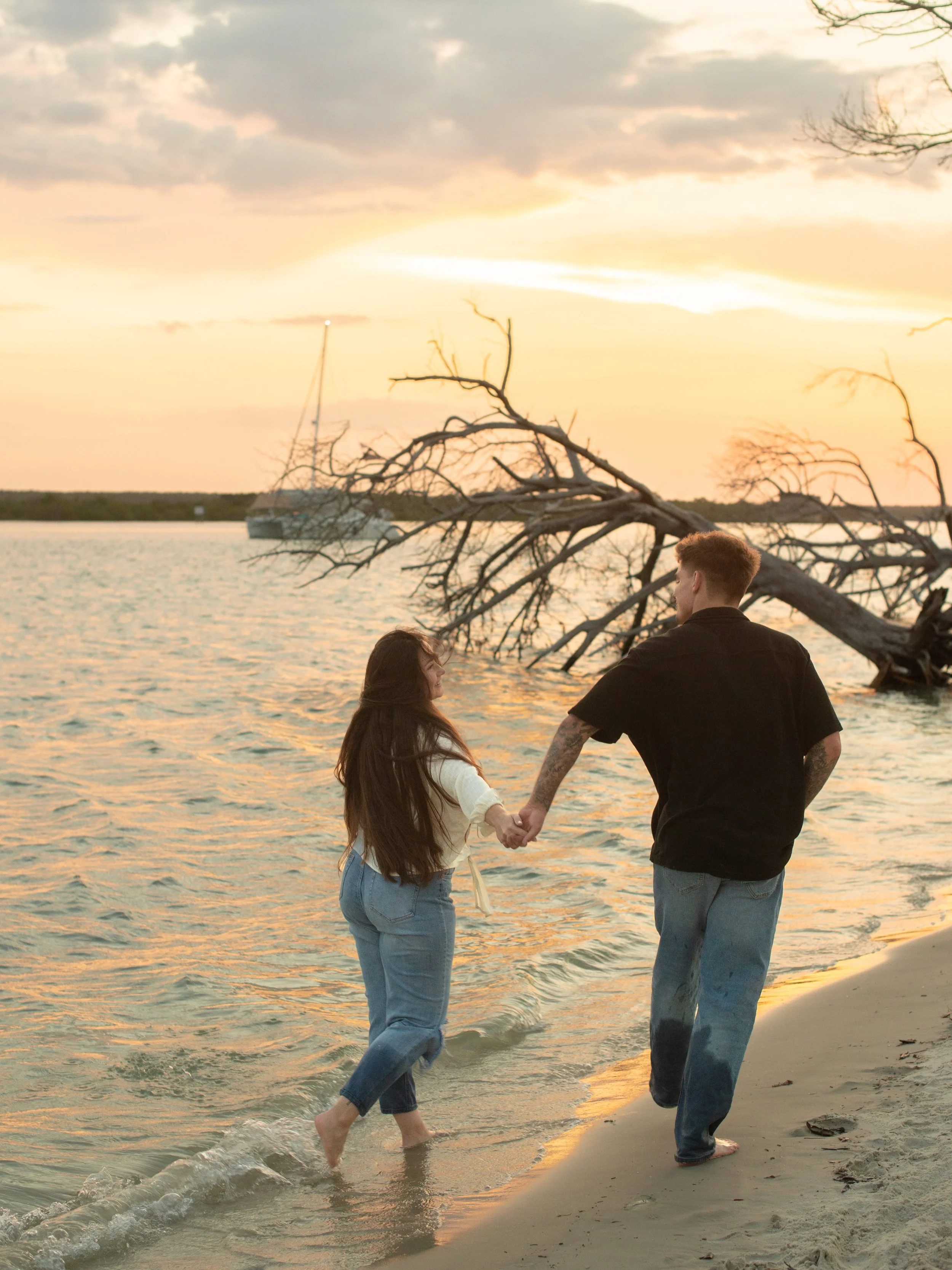 A summer sunset beach engagement session for Sydney &amp; Cale!! The sailboat, the colors, the love&hellip;.I just love the love between these two. They are high school sweethearts &amp; tying the knot next fall. This shoot makes me even more excited