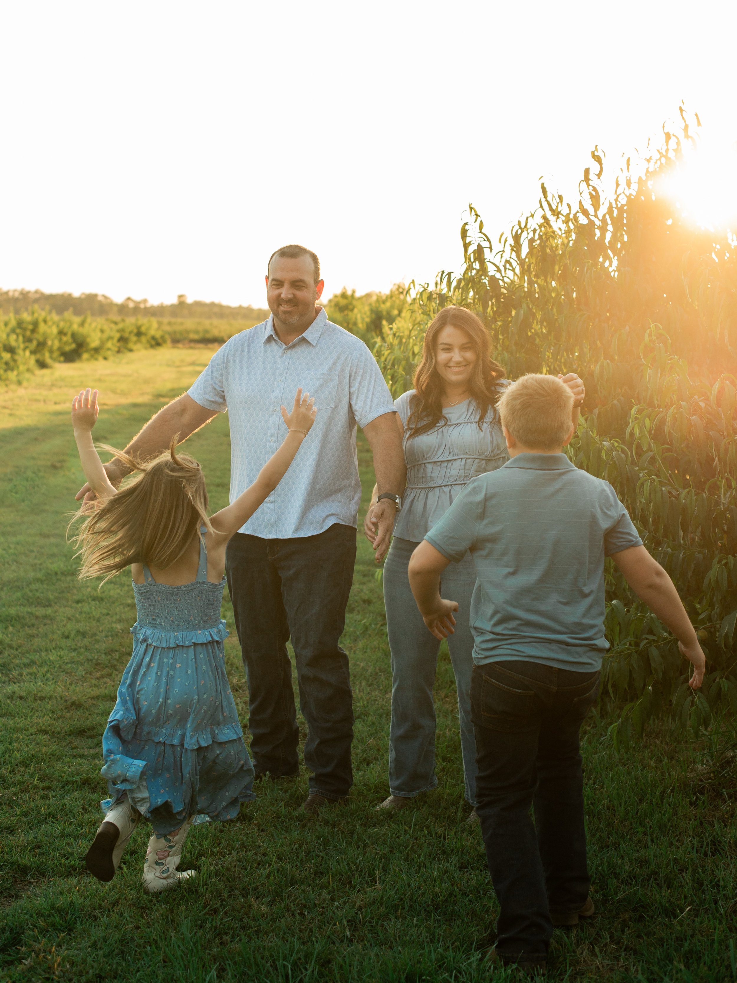 The cutest sunset summer session at the Wells family farm 🧡💛🩵 frolicking amongst the peach trees, twirling in the boots, &amp; giggles all around! Summer is a great time of the year for photography! Reach out today for a family, newborn, engagemen