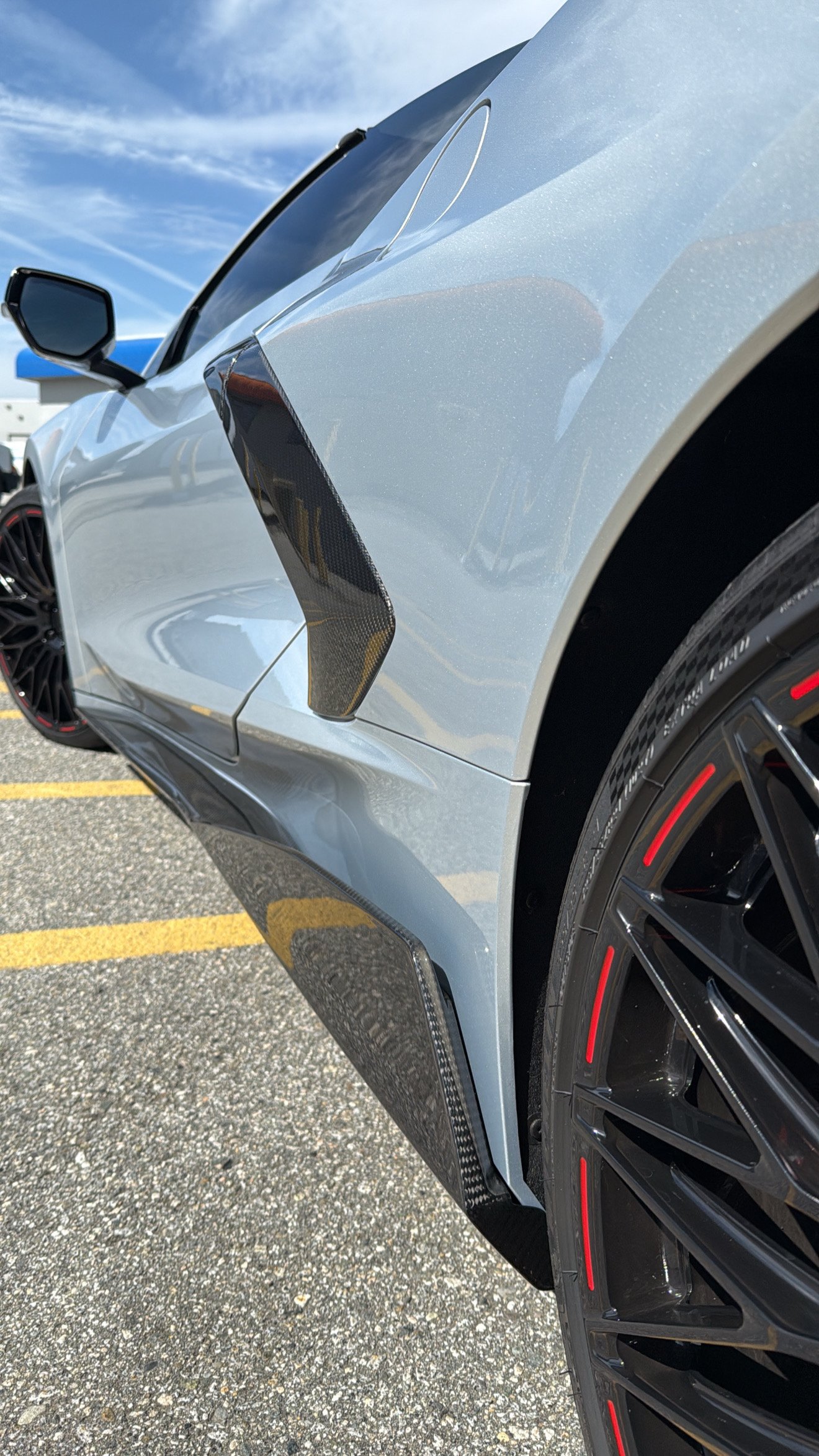 Close-up of a car's side mirror and window.