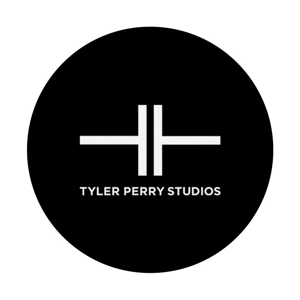 Tyler Perry Studios logo, black circle with white geometric design and text.