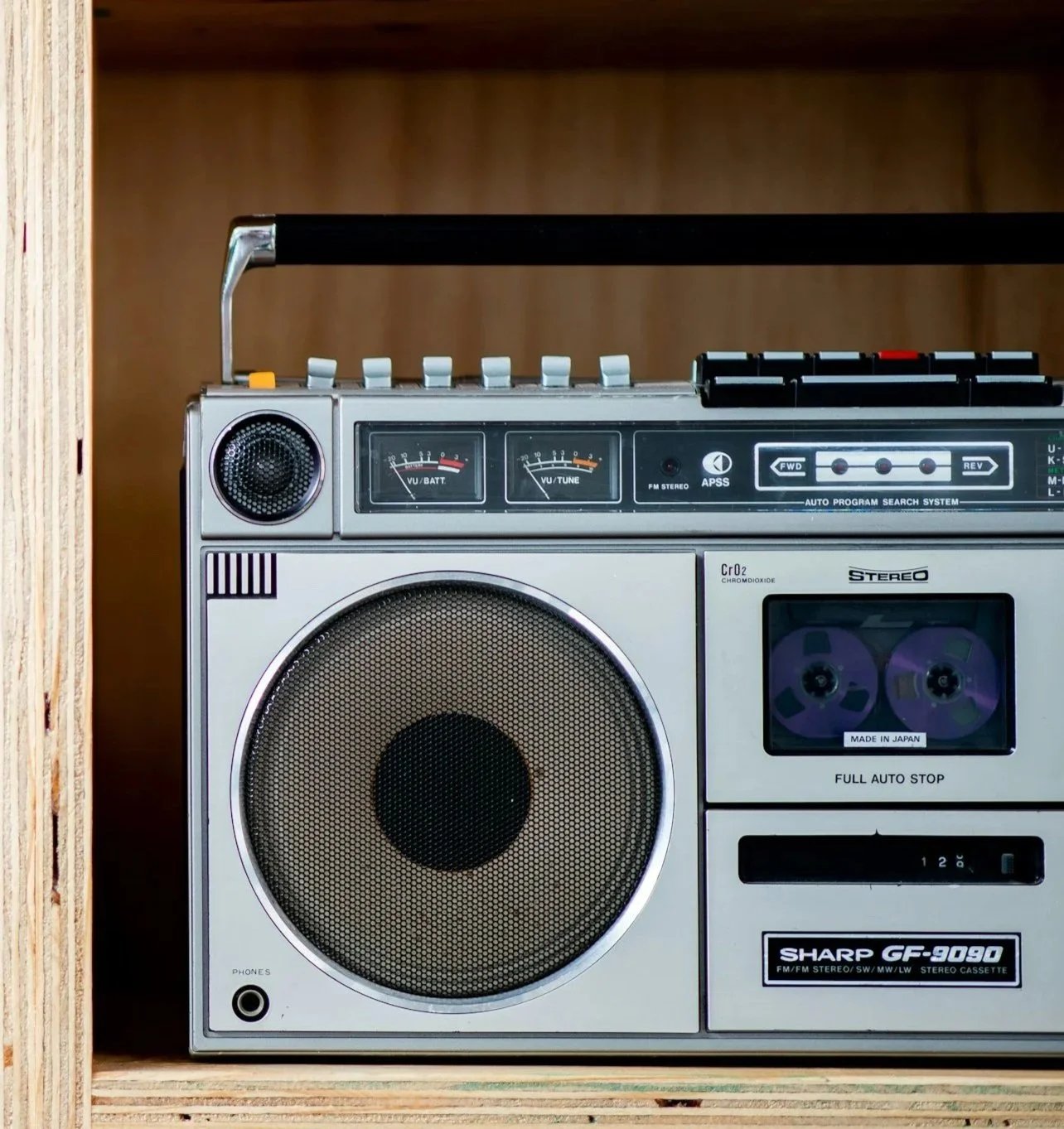 Photo of a Boom Box on a shelf.