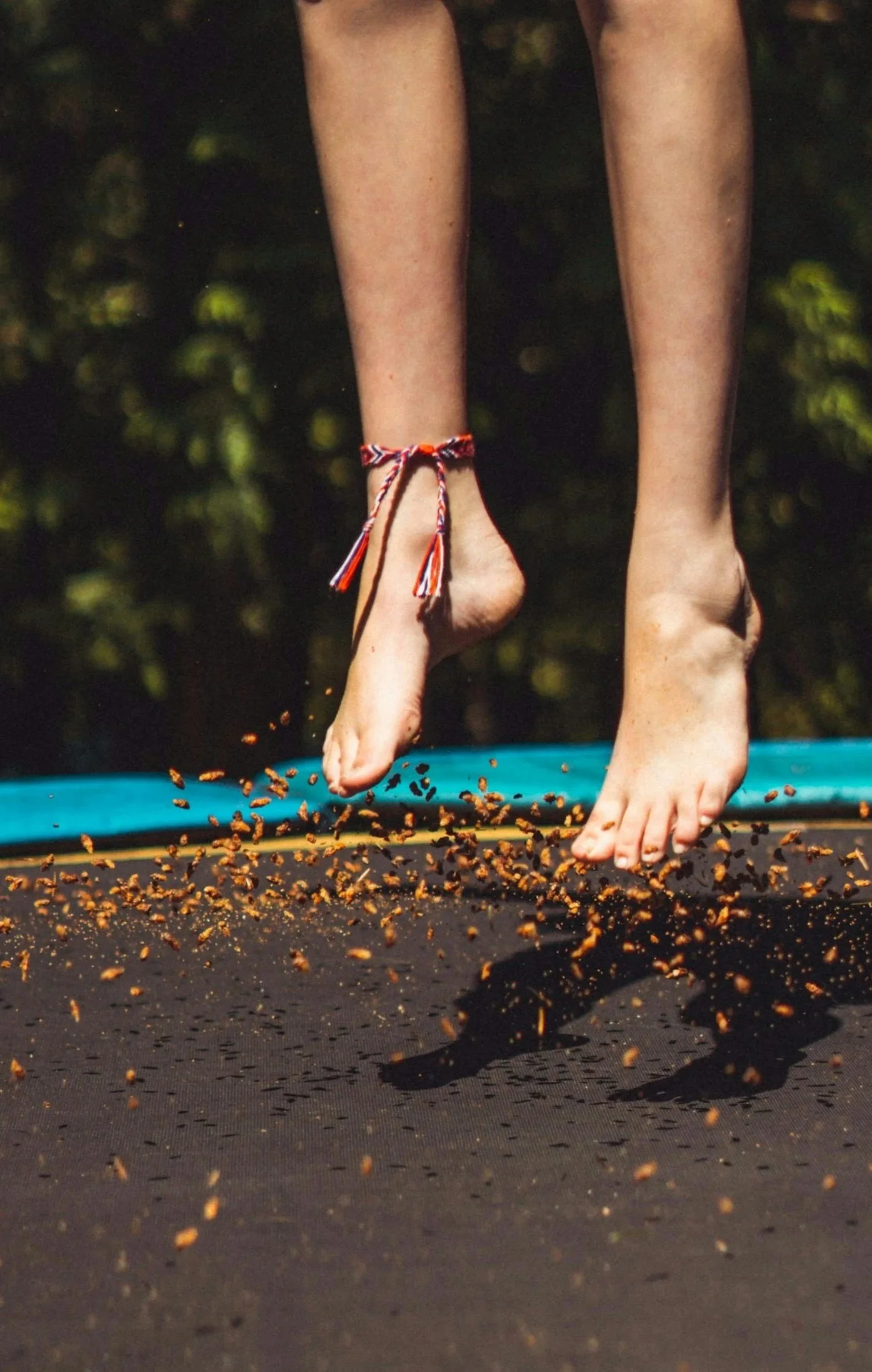 Jumping on a trampoline for proprioceptive input.