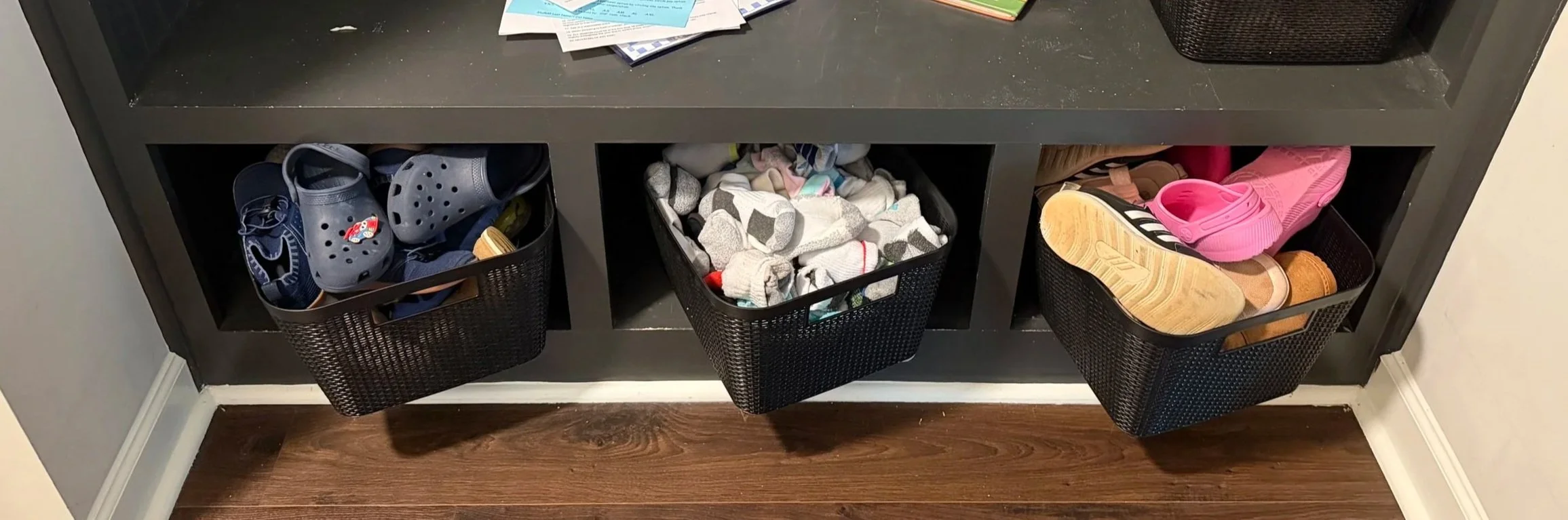 Photo of Taylor Shirkey's kids' sock and shoe organization system.