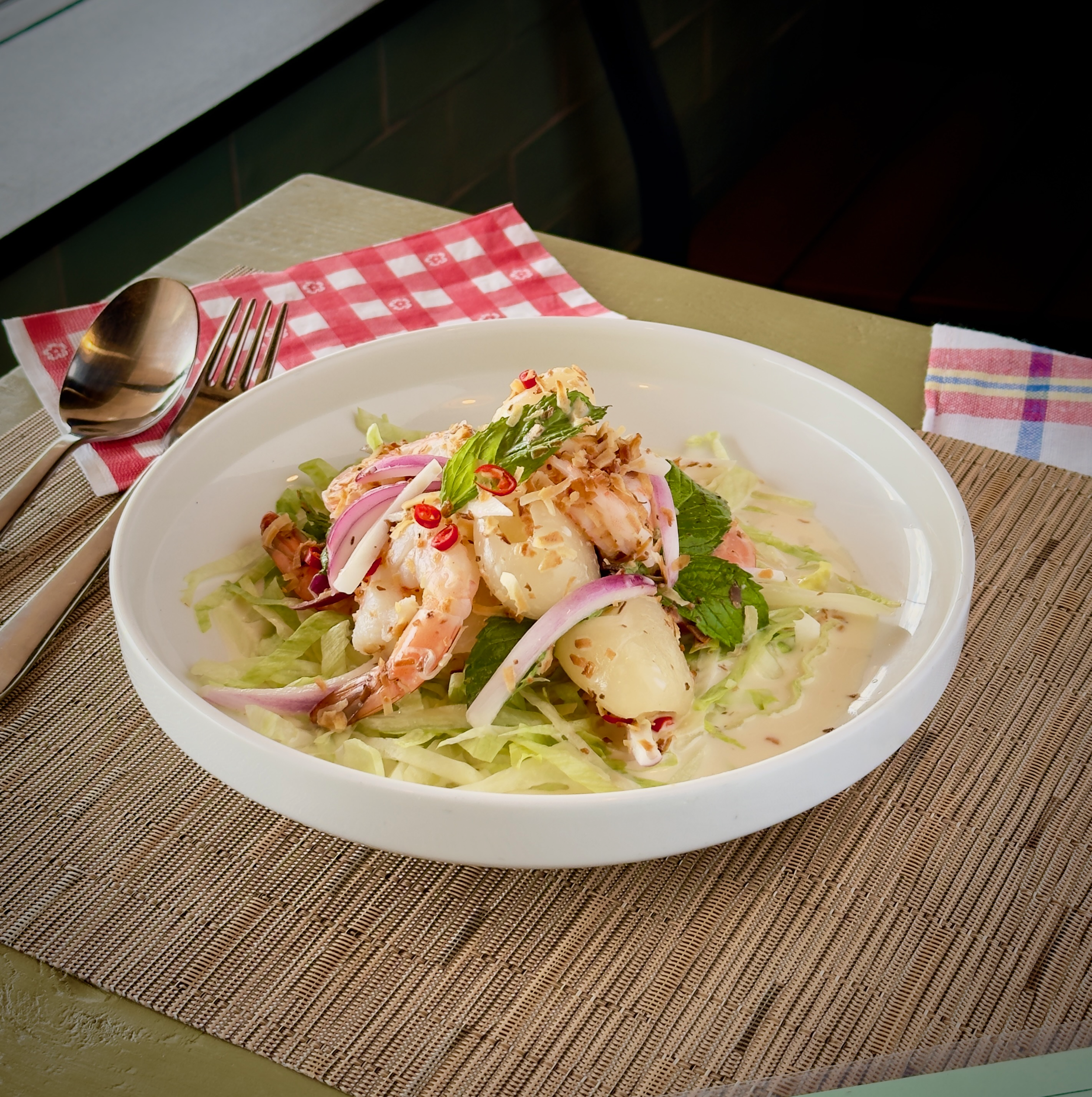 Mae Ornnit Salad - Tangy, Refreshing, Spice salad mixed with shrimp, rambutan, fresh chili, onion, mint, slice cabbage.
