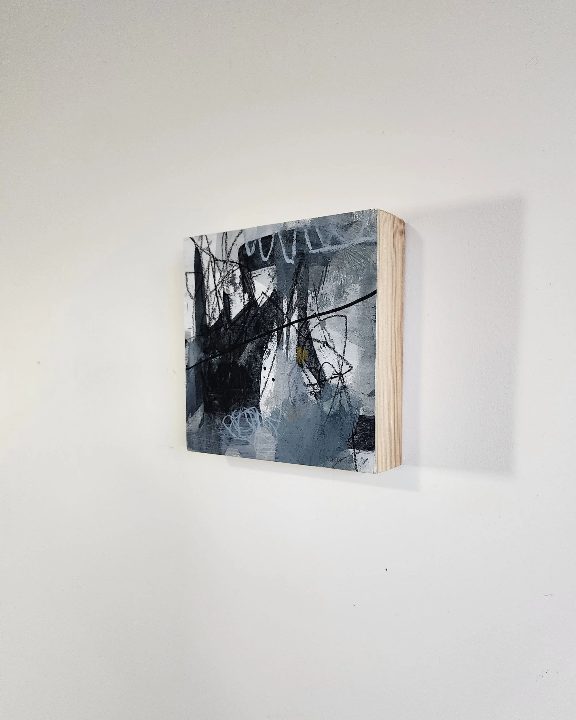 Side detail of Still Becoming, abstract mixed media artwork by Adrianne Johnson, acrylic, graphite, and pastel on paper mounted to wood, 6x6 inches.