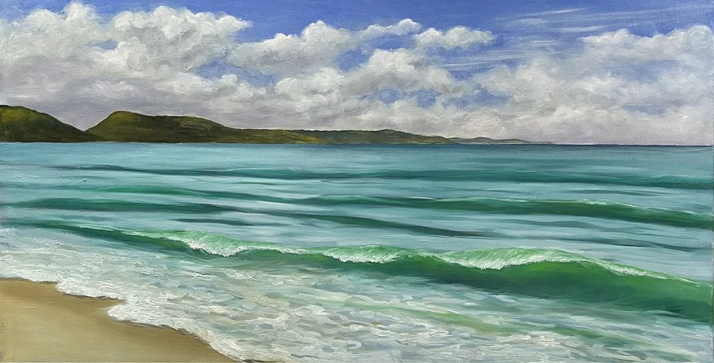 This panorama wall art titled Apollo Bay, by Daylesford artist Pam Gleeson, captures waves gently breaking on the beach in the late afternoon light.
