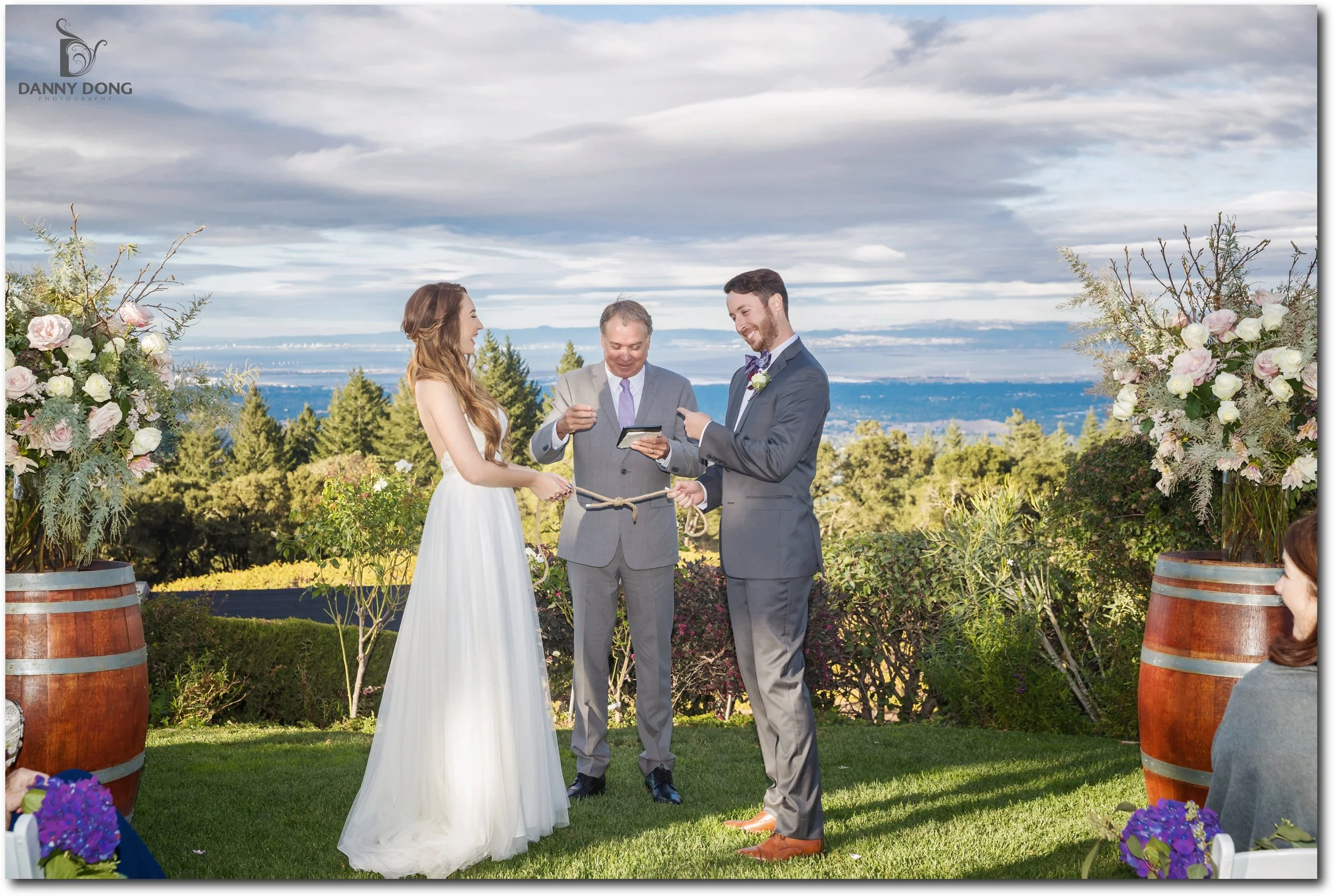 Colleen and Matt laughing with their officiant.
