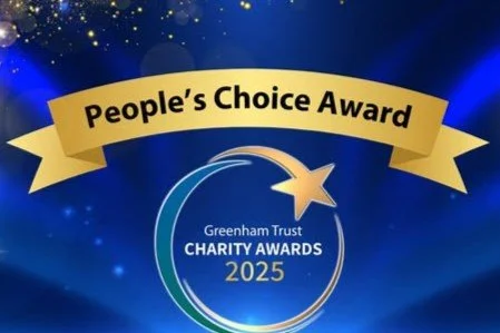 Graphic for Greenham Trust Charity Awards 2025 featuring a circular design with a shooting star and a blue and gold color scheme.