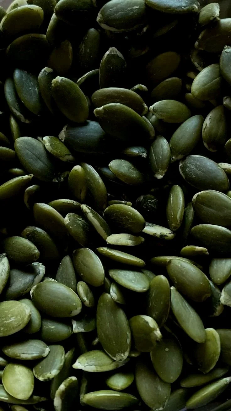 Close-up of green pumpkin seeds.