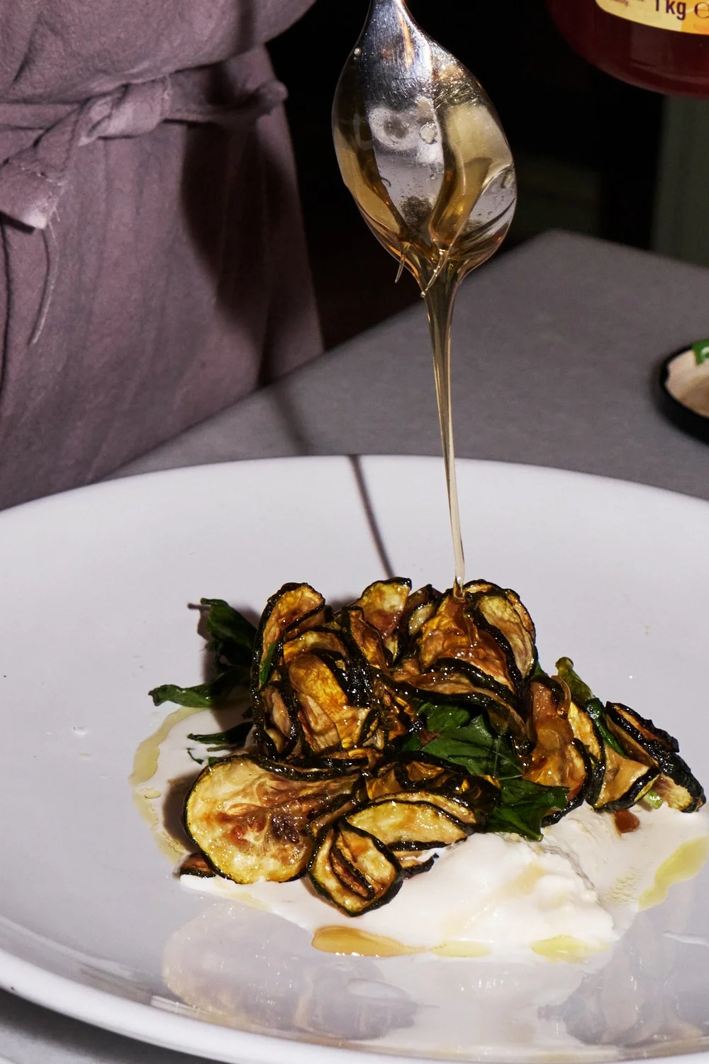 Private chef preparing a dish for a Mediterranean Food Journeys event