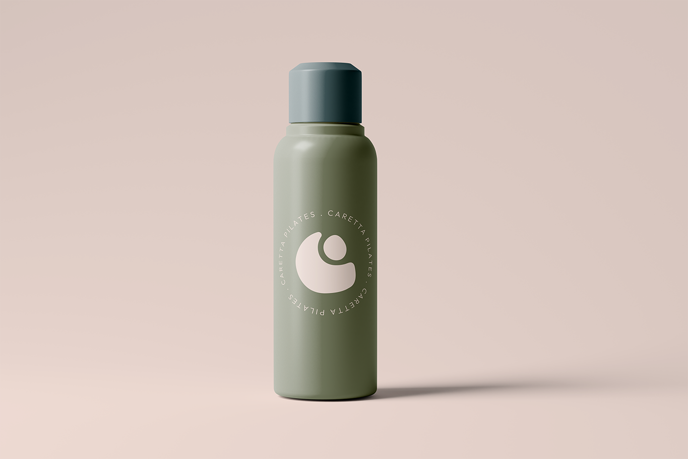 A green cylindrical bottle with a light gray cap on a light pink background. The bottle has a circular logo with the text 'Carette Pilates' around it.