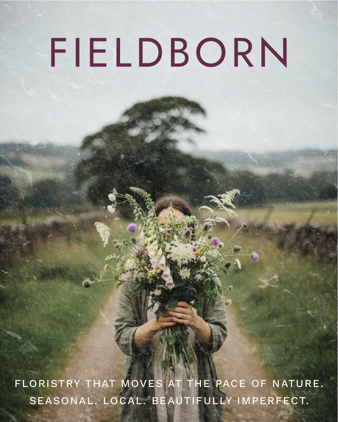 Cover image for a florist-themed publication titled 'FIELD BORN' featuring a woman holding a large bouquet of wildflowers on a rural path with fields and a tree in the background.