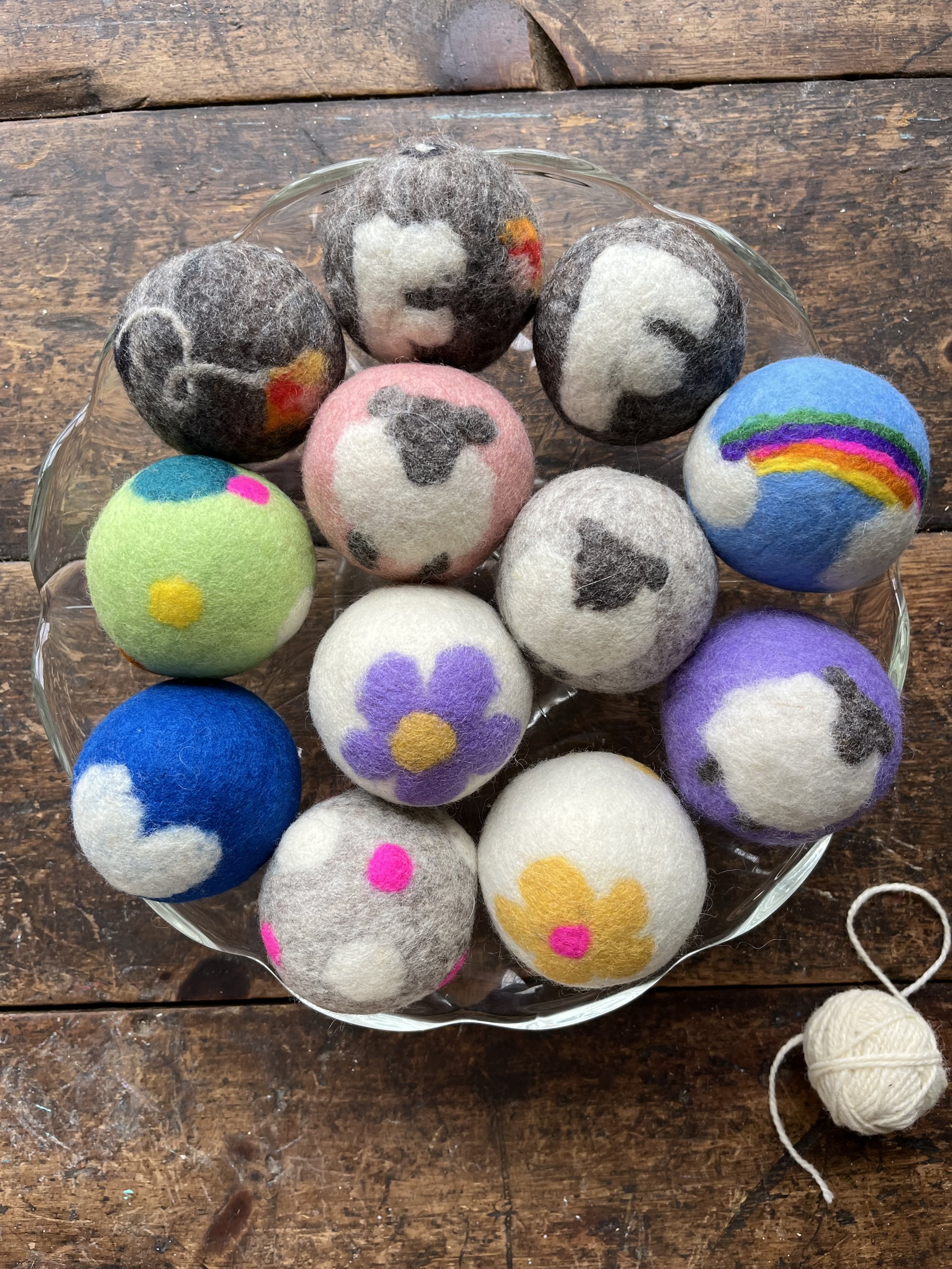 wool yarn ends and roving hand rolled and felted, turned into energy saving and colourful dryer balls.