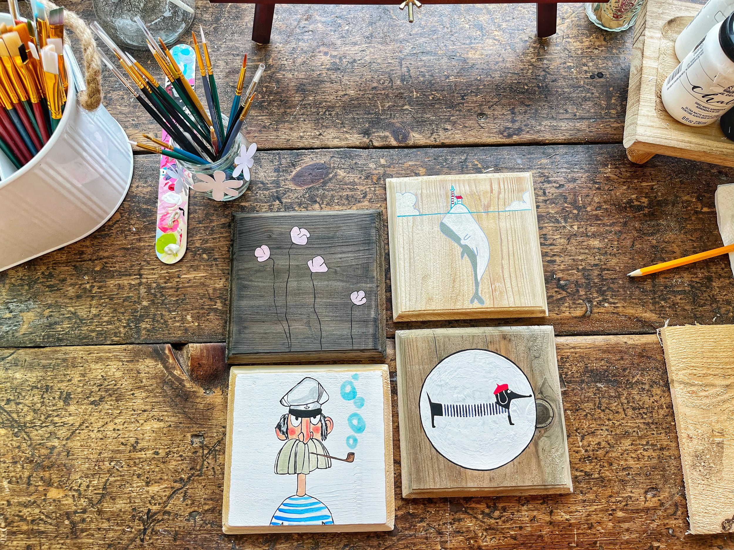 Handpainted cedar tiles from salvaged wood.