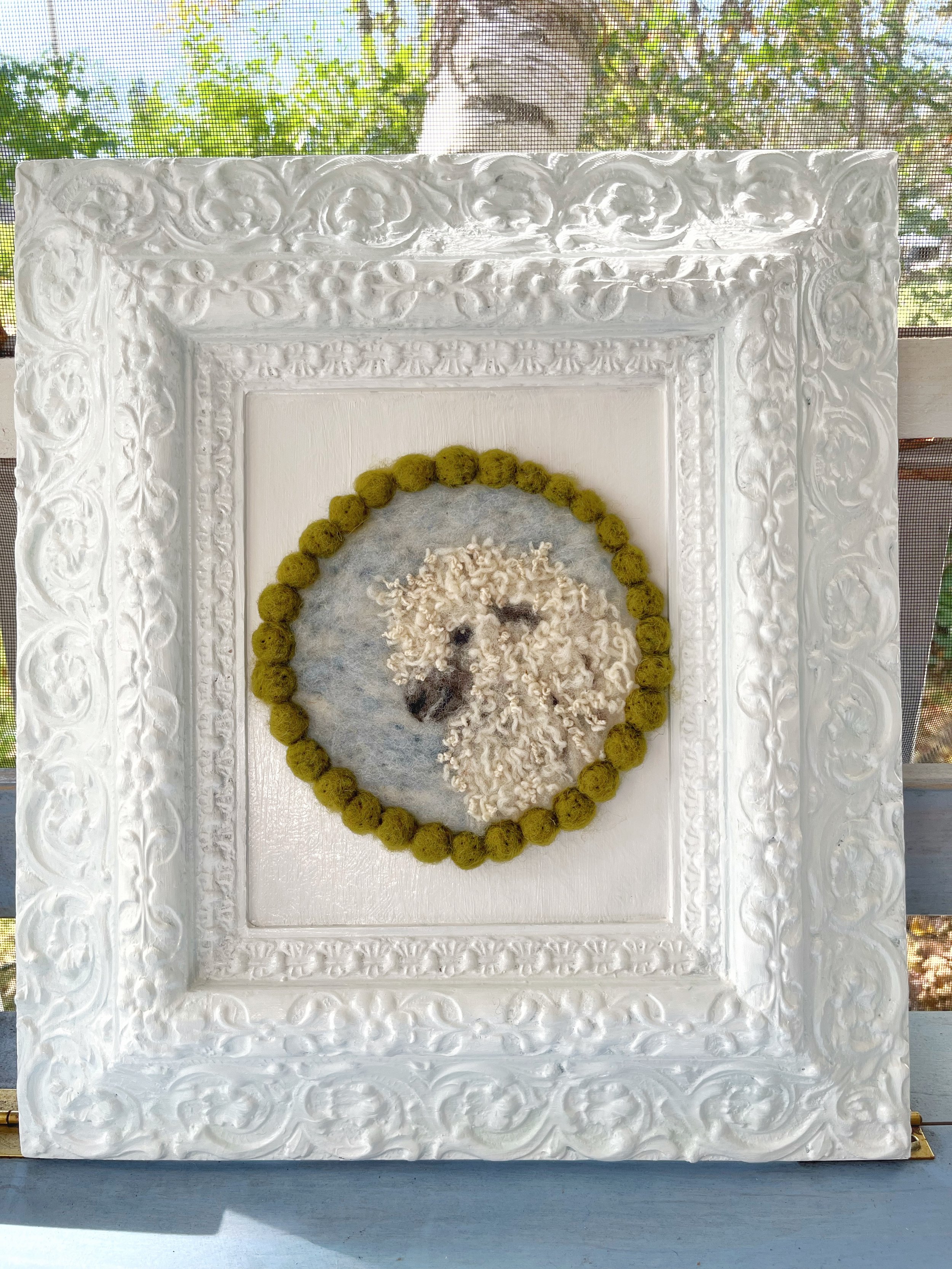 Salvage old wood frame, with fresh paint and a hooking and wool art centre.