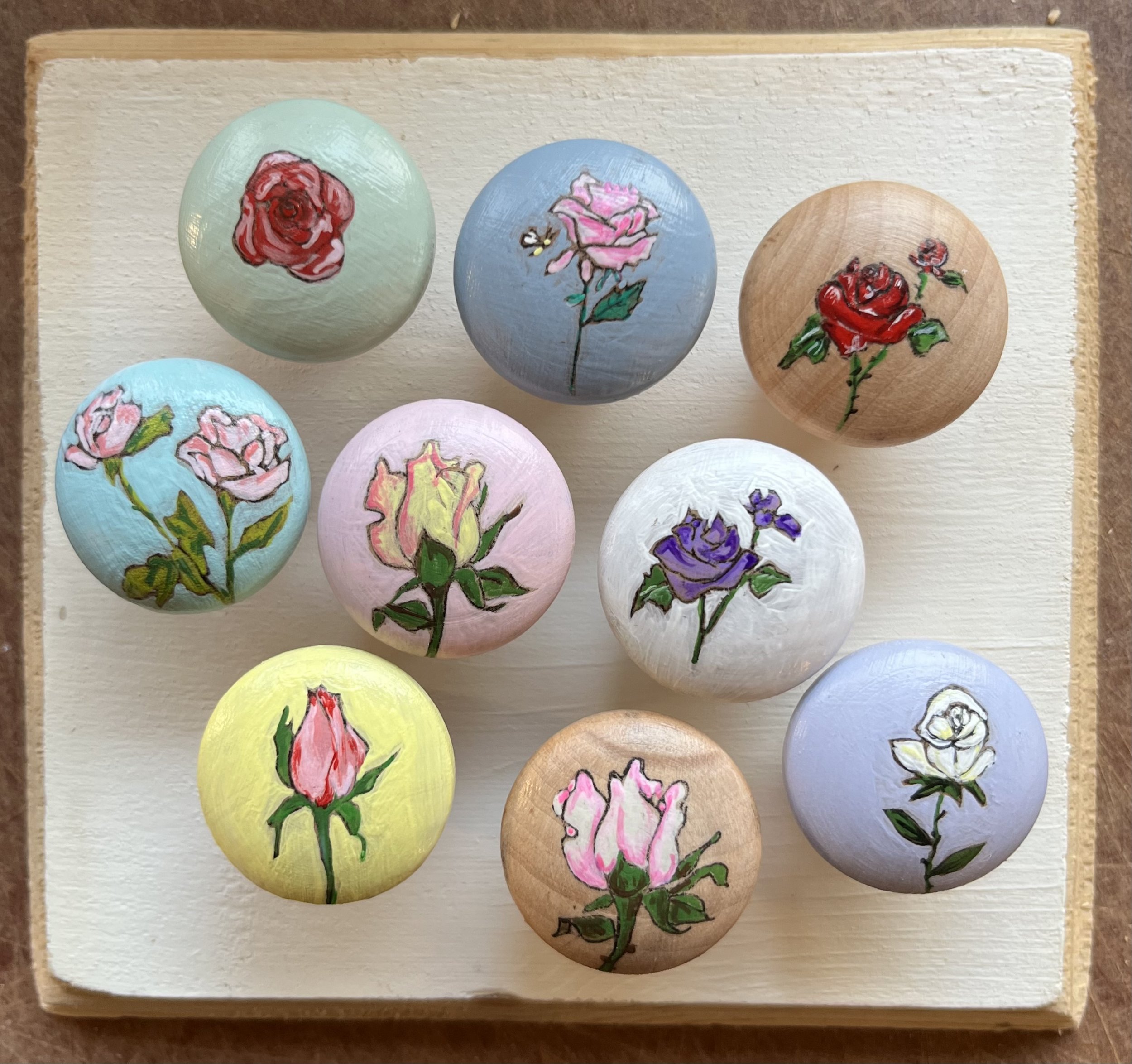 old wooden drawer and door knobs, hand painted to refresh.