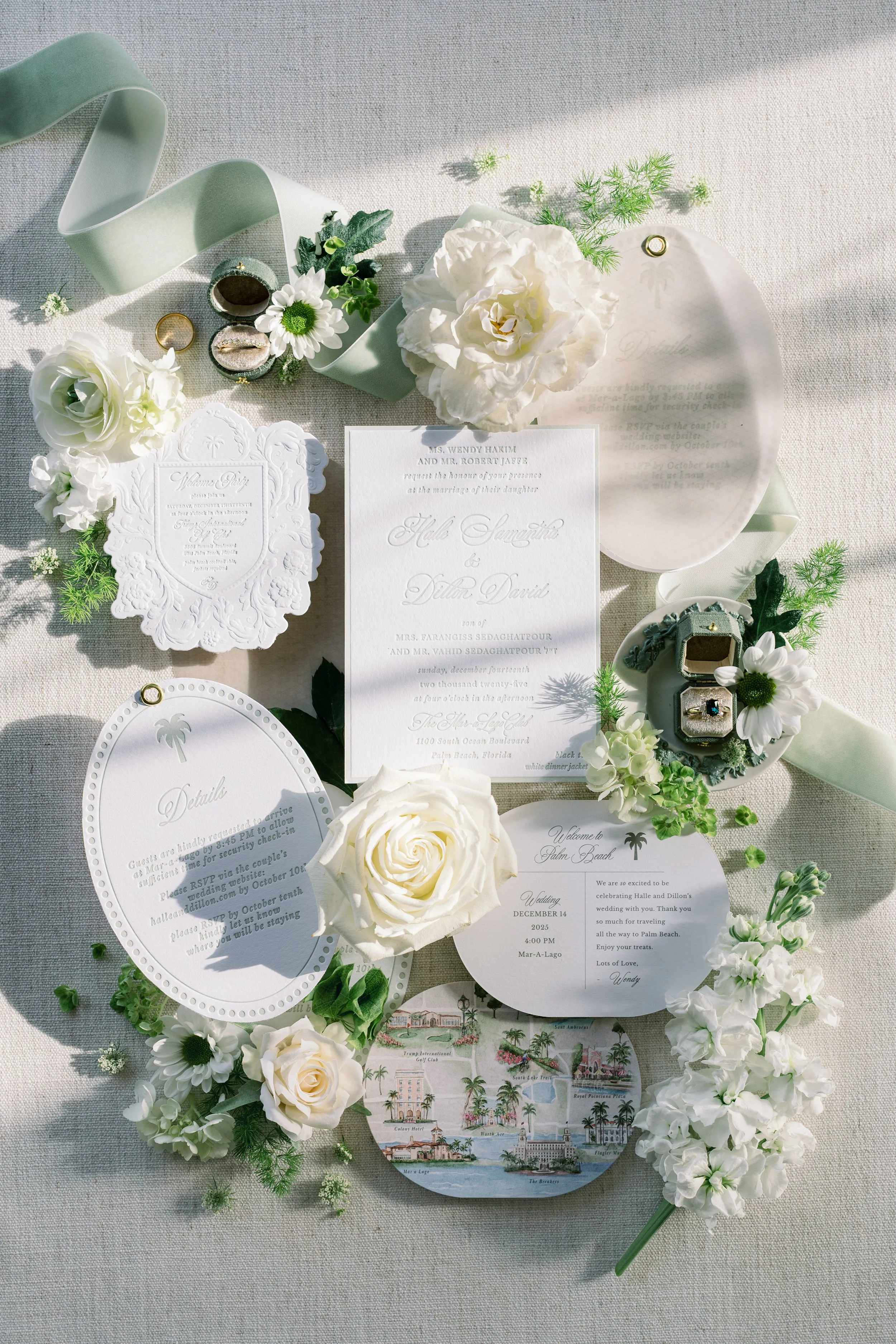 a custom invitation suite with letterpress, embossing, sculpted emboss and velum with custom map