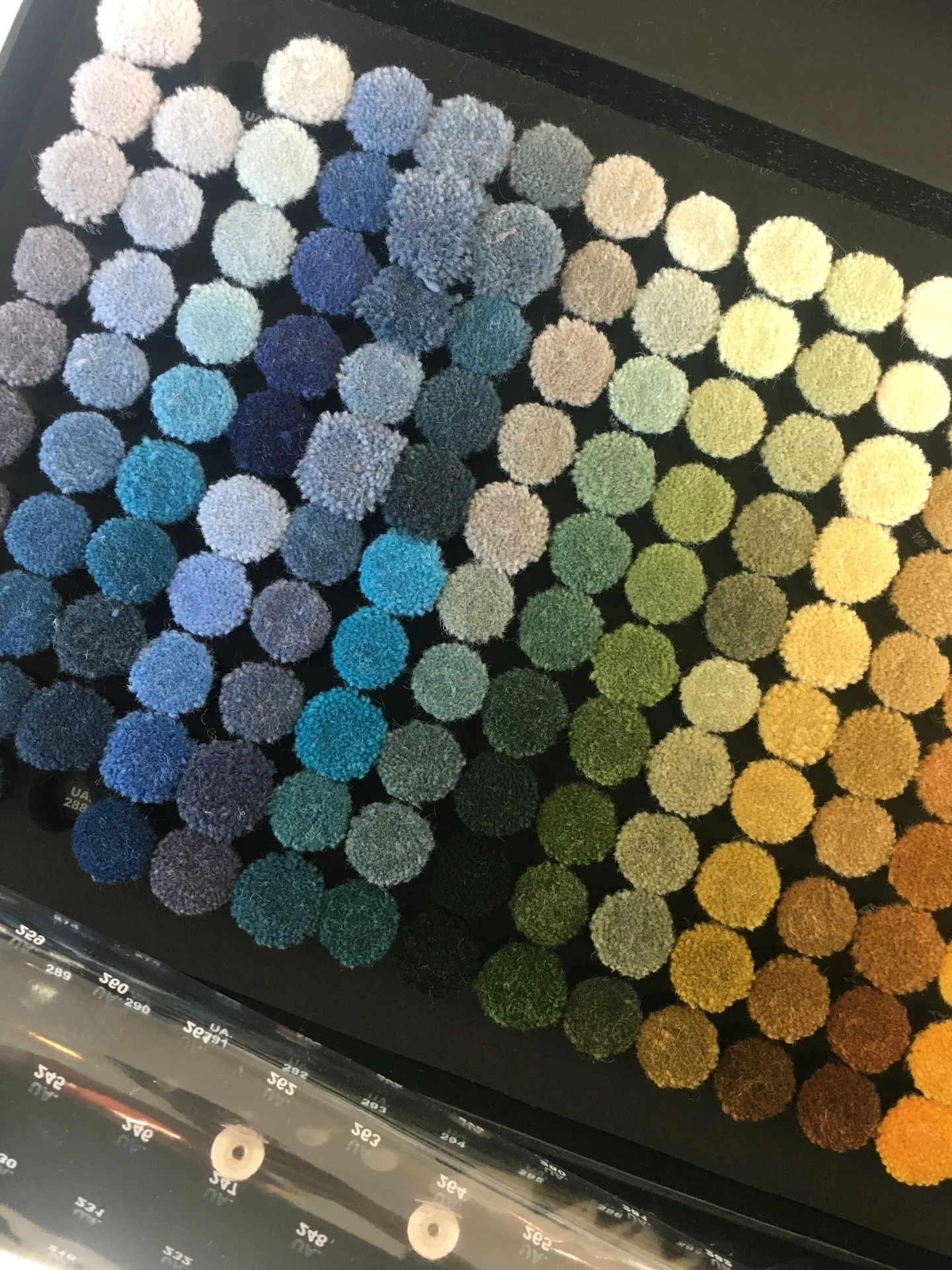 Picking color poms! It can be hard to choose from such a beautiful palette, but it's such a fun part of the process!

#CustomRug #ColorPoms #InteriorDesign #ColorfulInteriors