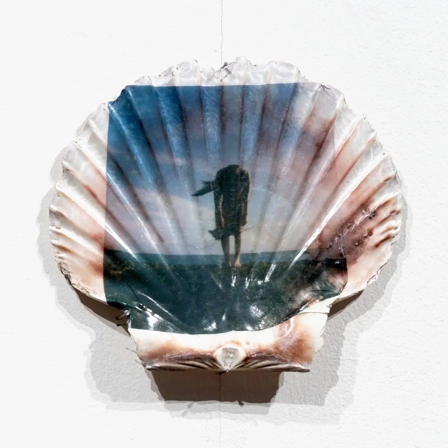  Landlocked (2025) 
A nod to Venus, yet here she folds over, slouching. Her body bears a burden; tethered to the shore. The shoreline is both boundary and barrier, a place of yearning and constraint. She is landlocked by legs that cannot return to th