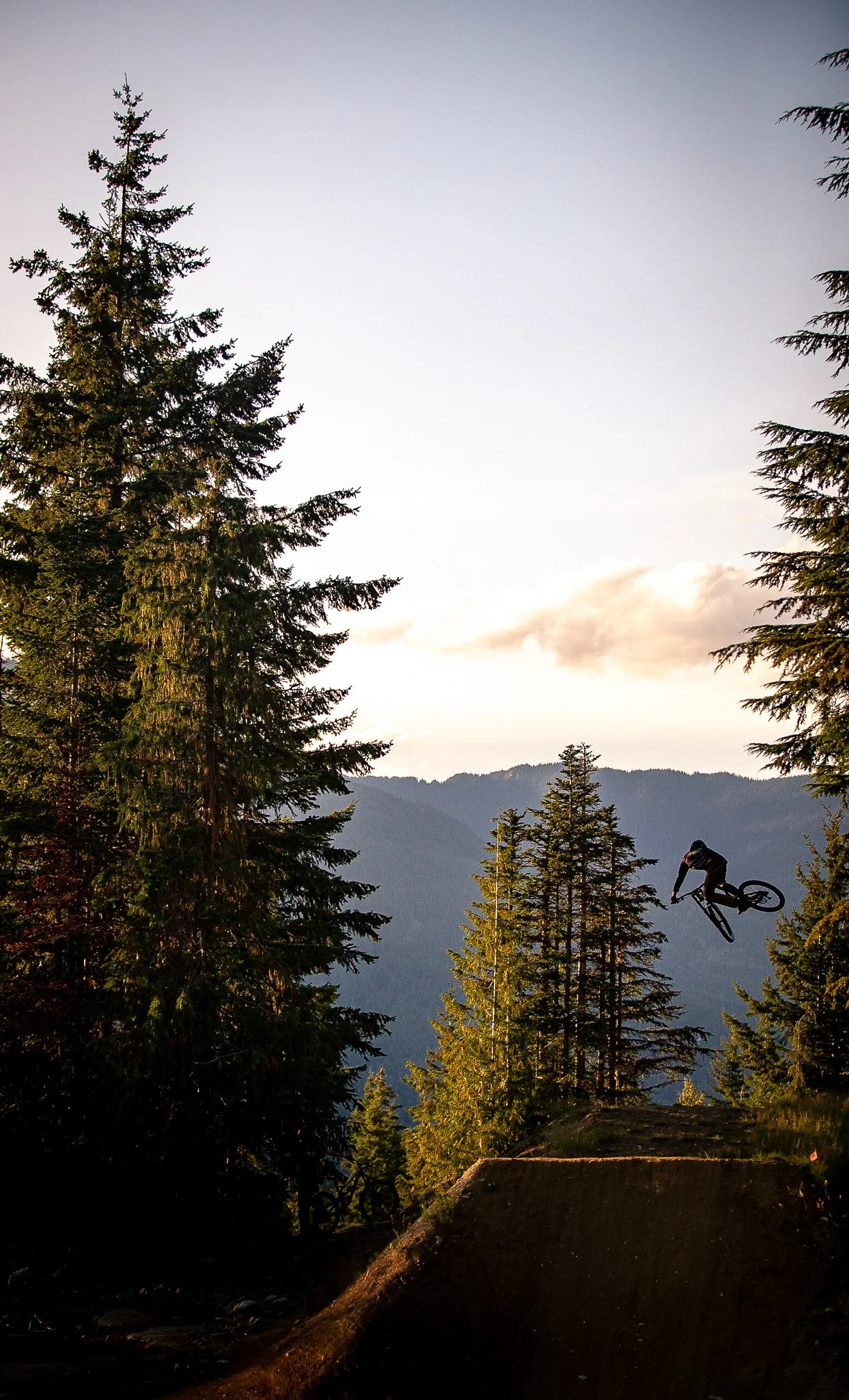 A mountain biker during whip offs on Crabapple Hits expert jump line in the Whistler Mountain Bike Park