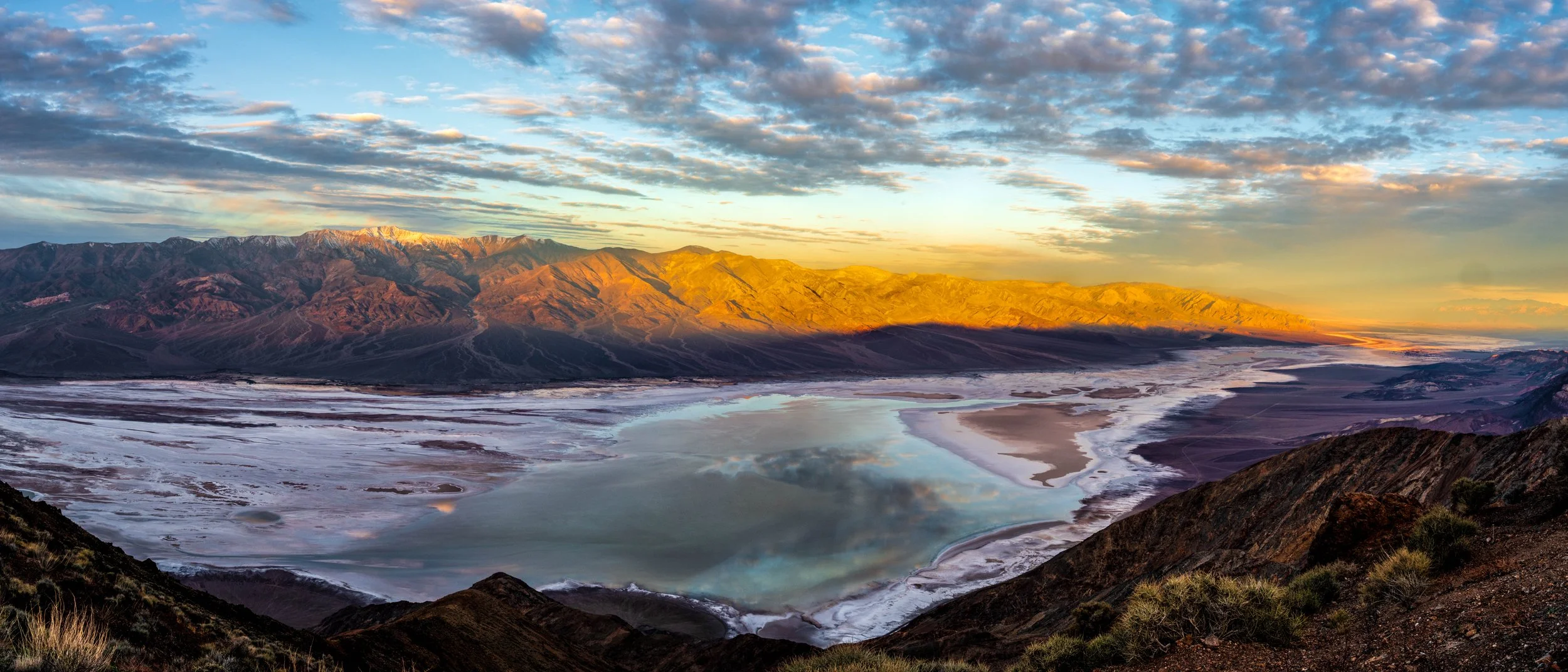 Manly Lake at sunrise - seen here from Dante's View. As the sun rises the colors of the sky, surrounding peaks and lakebed take on a myriad of colors.