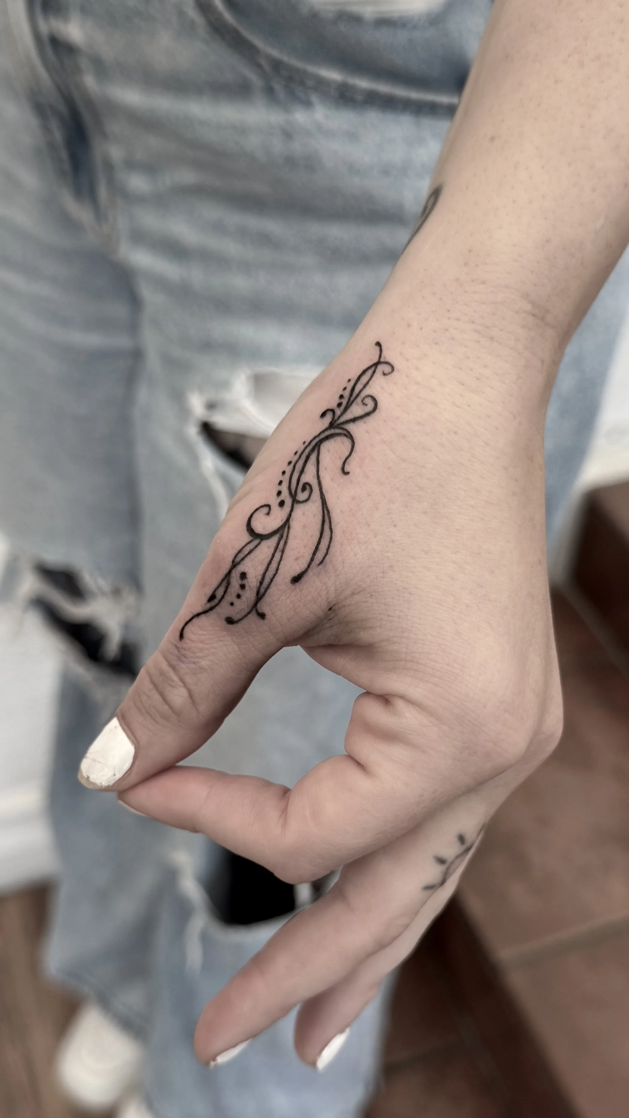 minimalist fine line hand woman tattoo near me