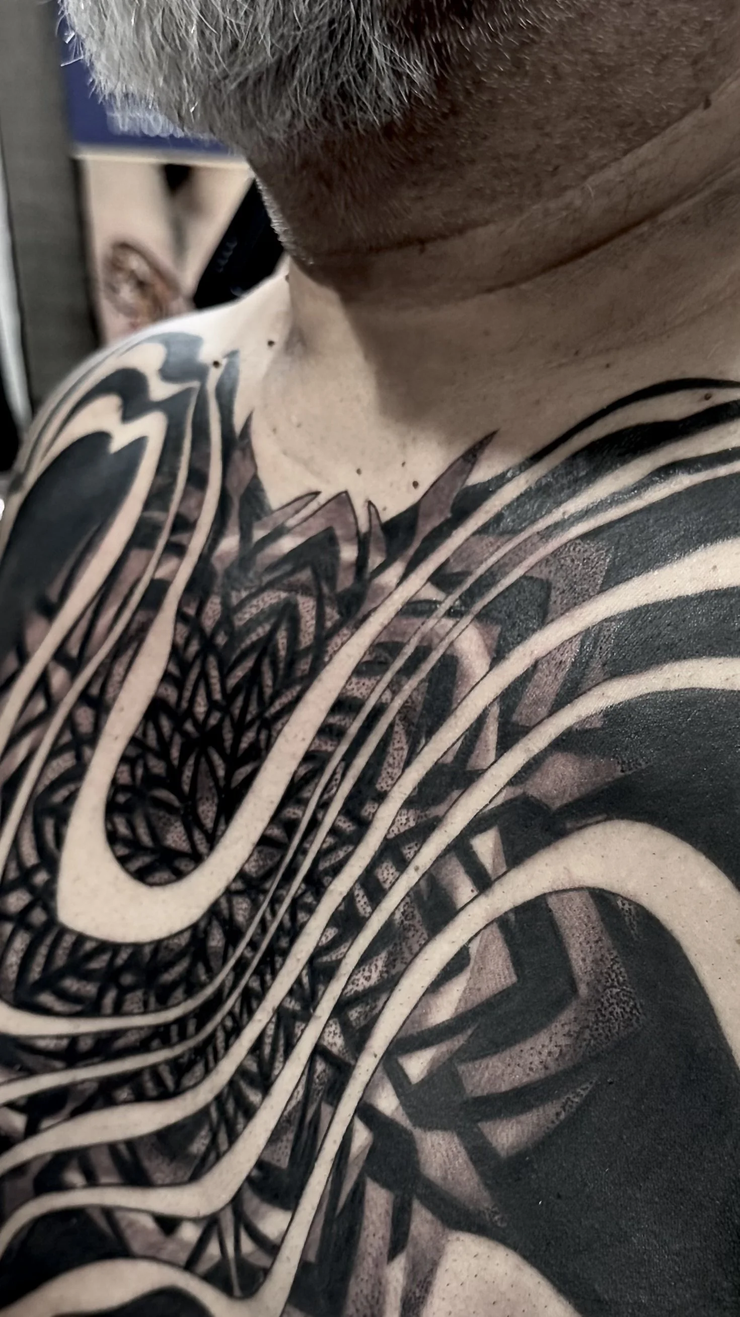 large mandala black work chest piece best tattoo studio near me