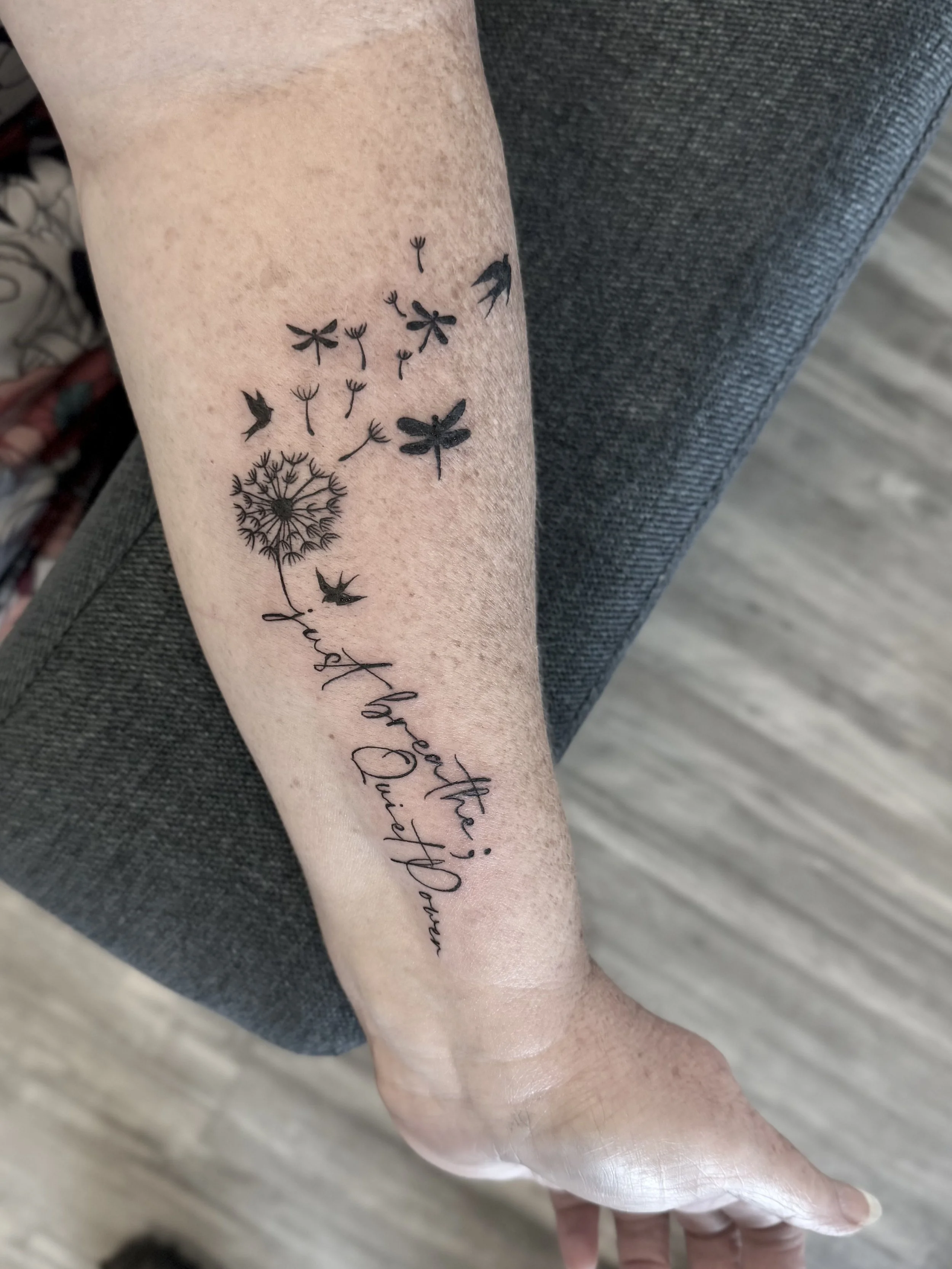 dainty writing tattoo female artist
