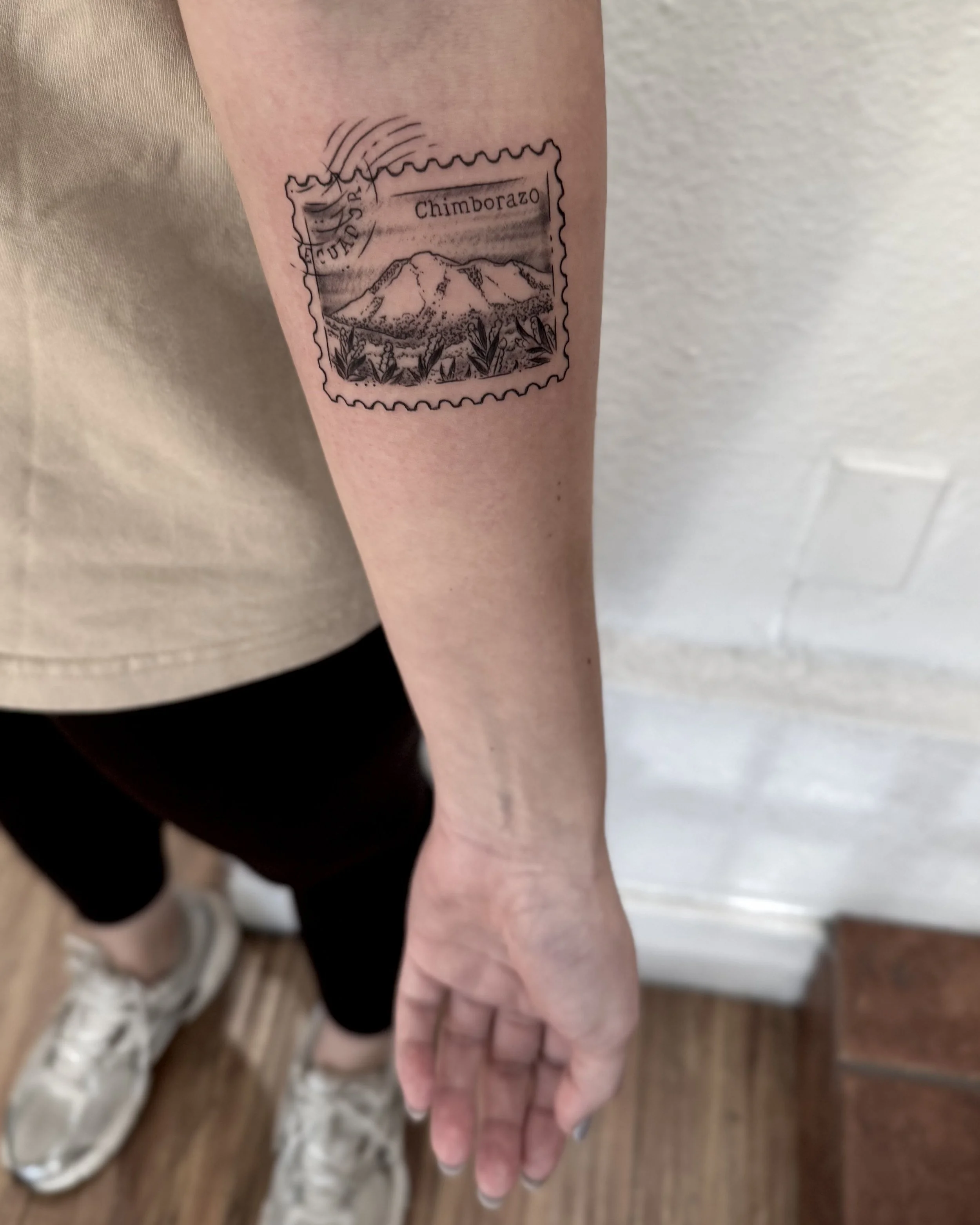 forearm stamp tattoo fine line artist Los Angeles
