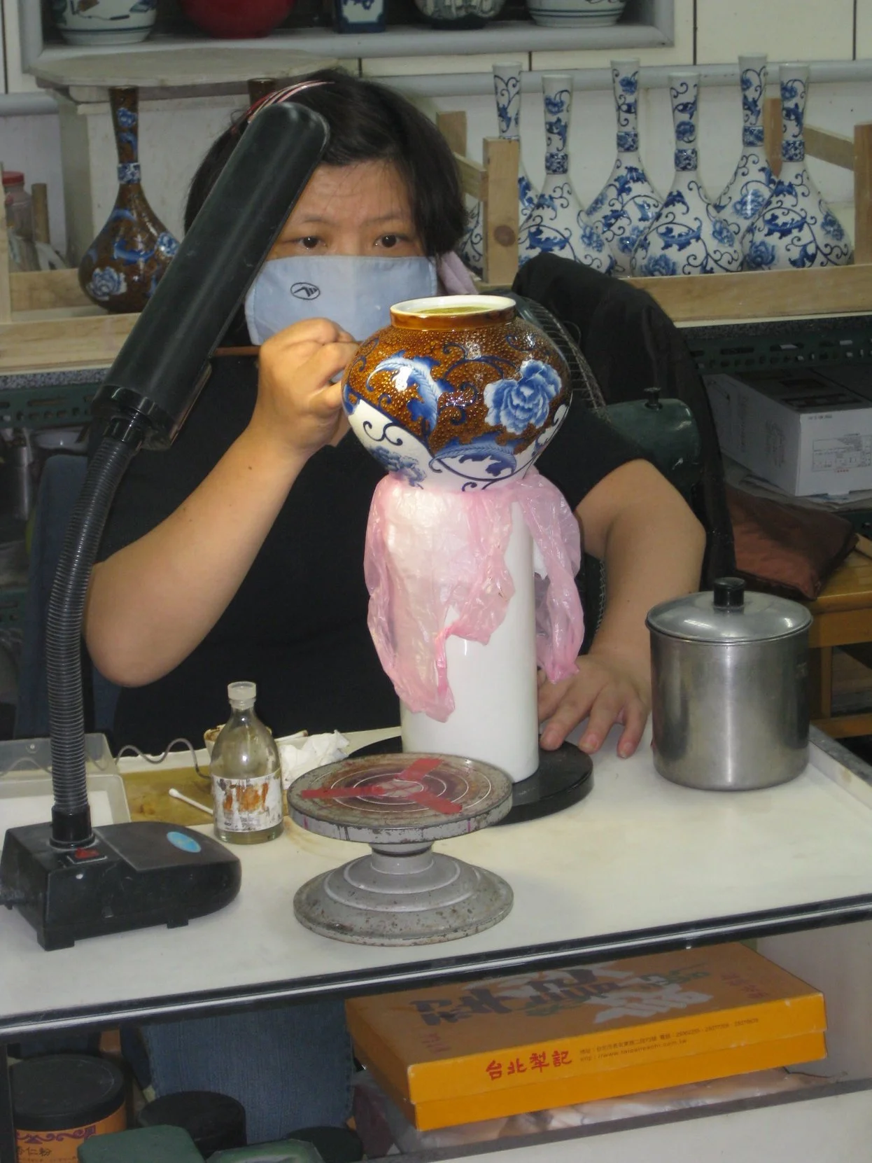 A woman carefully creates pottery in Yingge during a Tricia Pomering Cultural Experience in Taiwan.