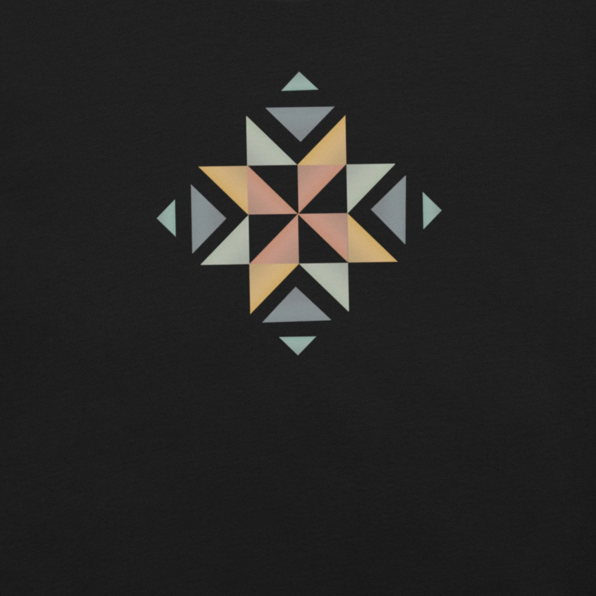 The front of a black shirt with a beautifully designed quilt block in multiple colors on the front.