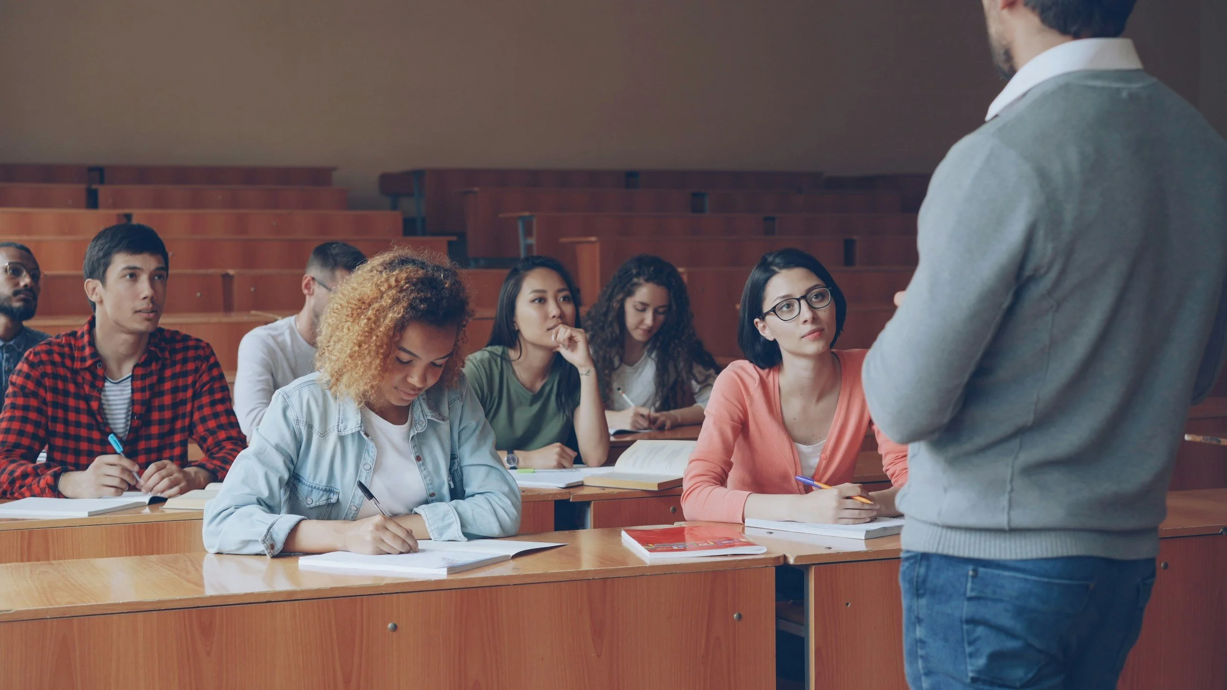 International students attending a university class in Brisbane, representing support and counselling services for international students.