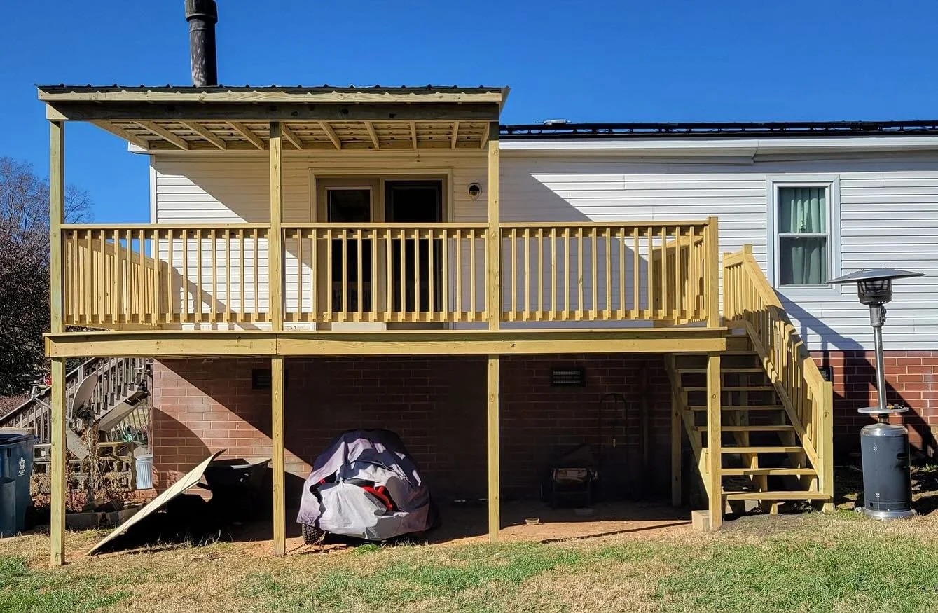 Pressure treated wood deck with new metal roof addition! Full tear down and rebuild in 5 days!