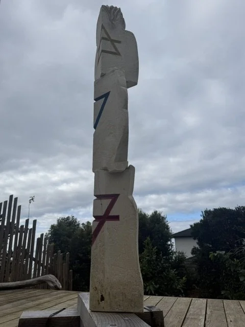 hand carved Oamaru stone, incised and coloured with acrylic 